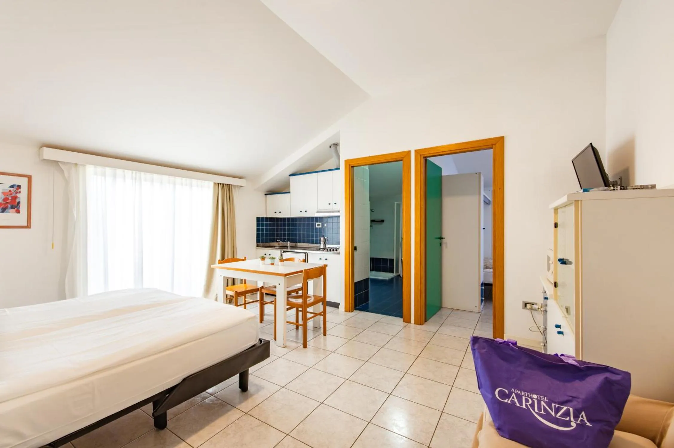 Kitchen or kitchenette, Bed in Aparthotel Carinzia