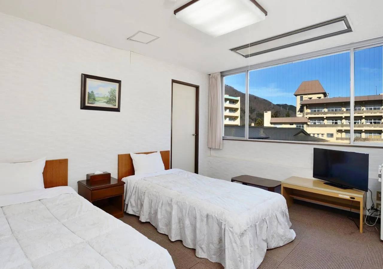 Photo of the whole room, Bed in Itoen Hotel New Sakura