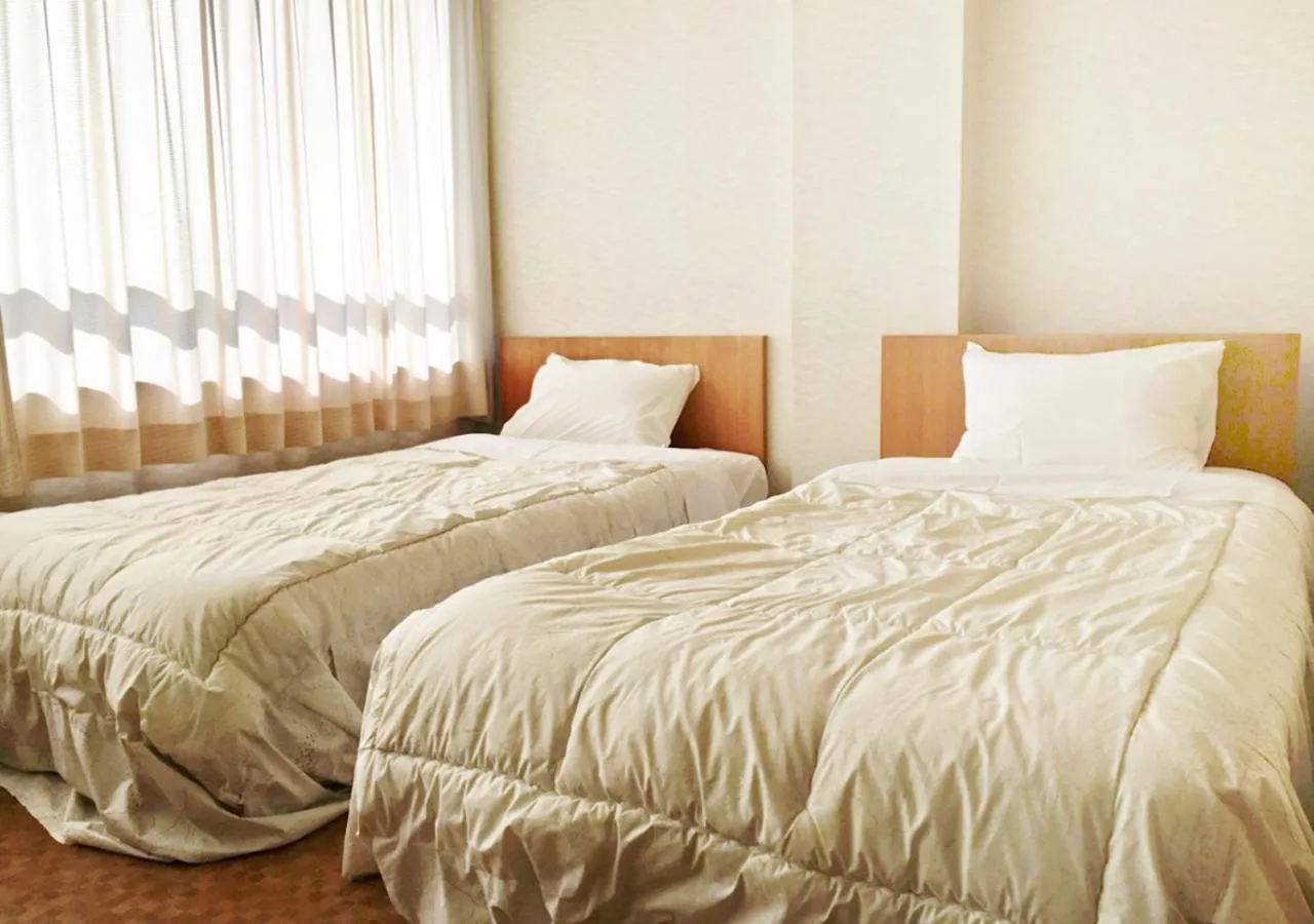 Photo of the whole room, Bed in Itoen Hotel New Sakura