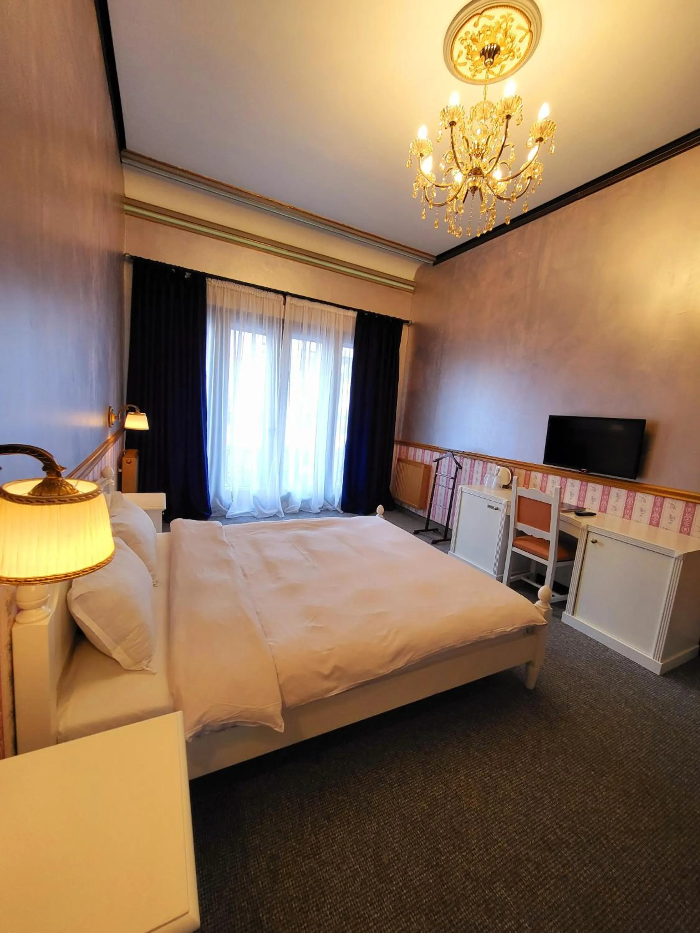 Photo of the whole room, Bed in NF Palace Old City Bucharest