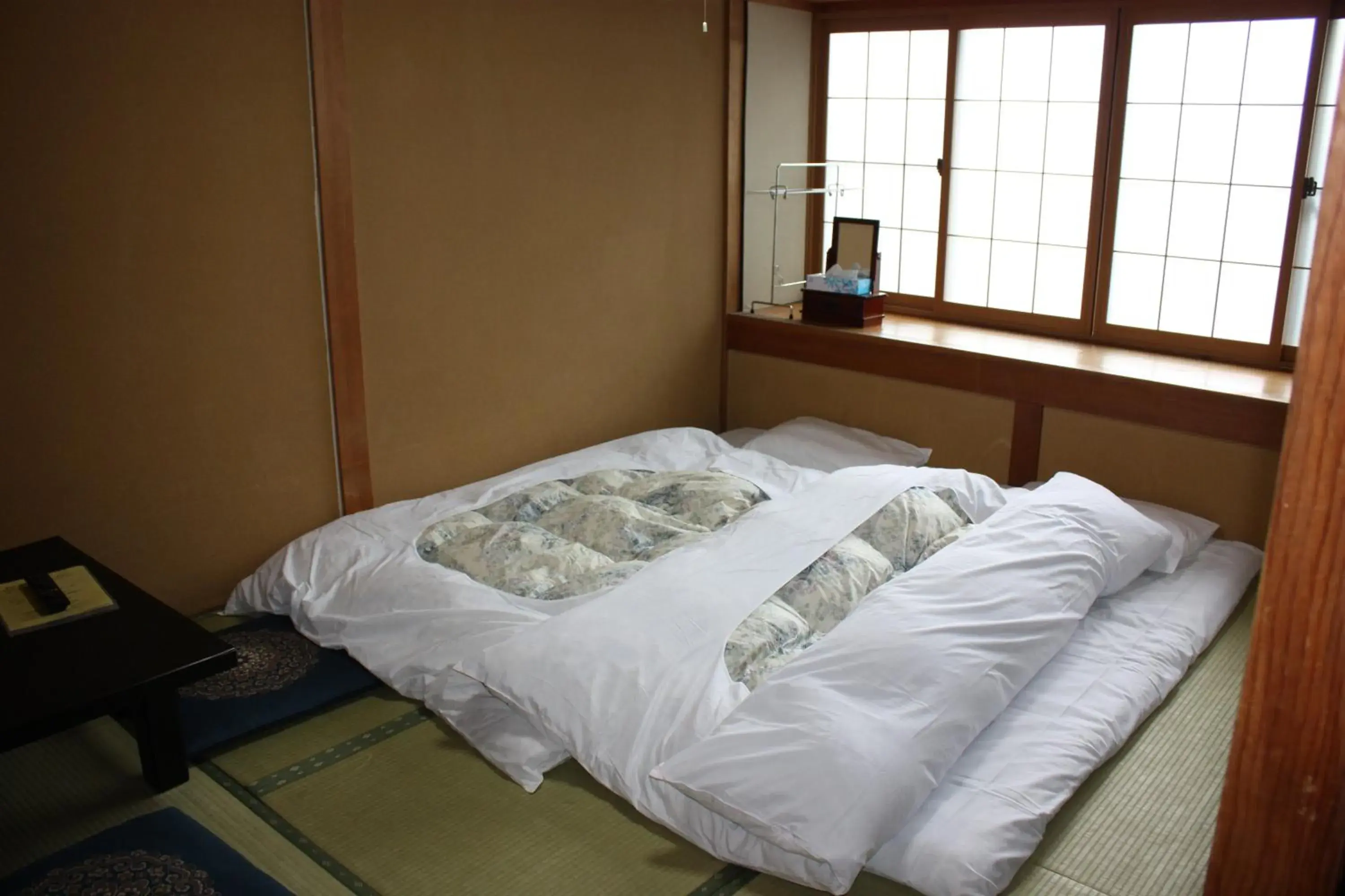 Bed in Ryokan Murayama Bed in Ryokan Murayama