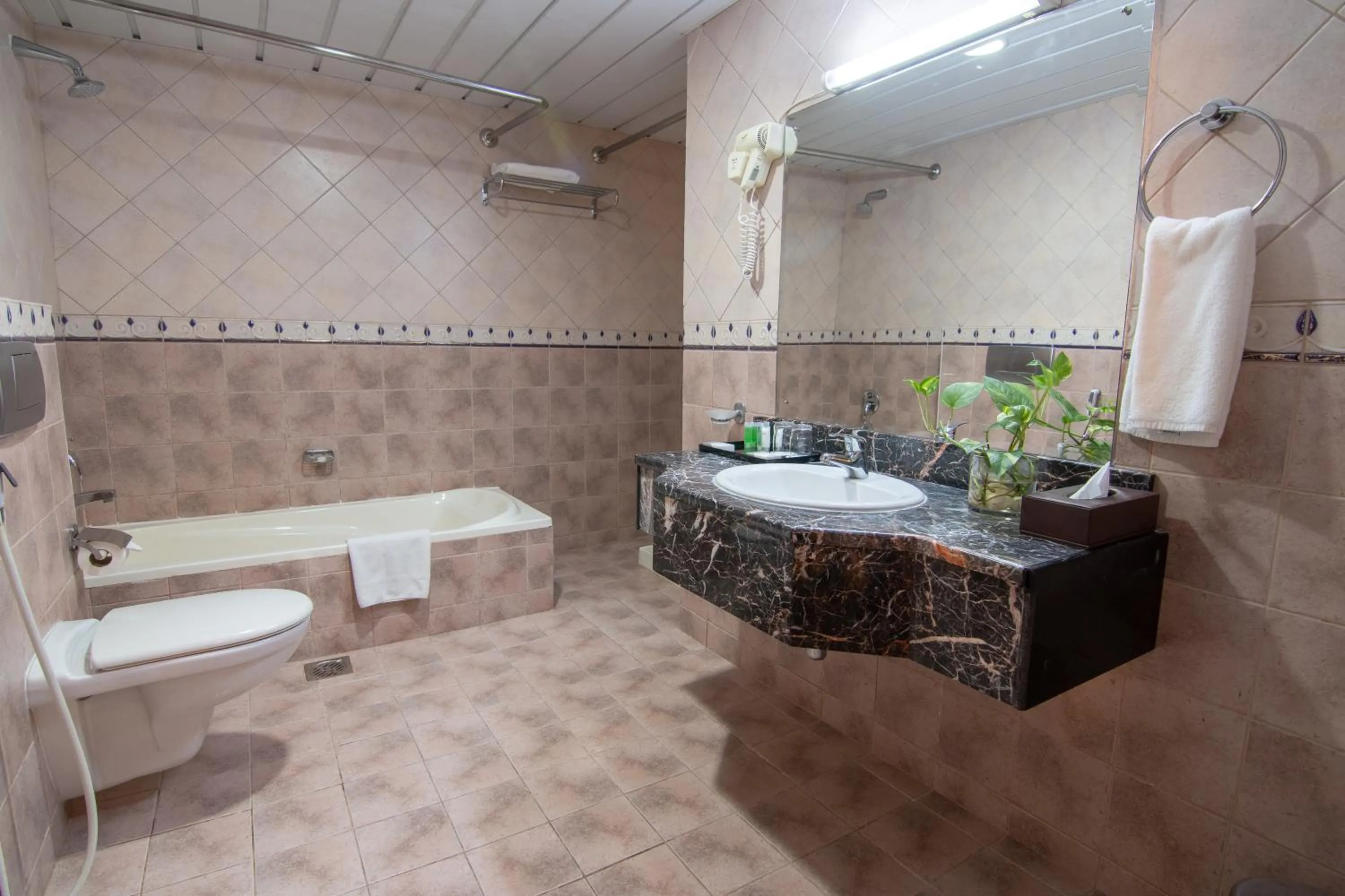 Shower in Garden Hotel Muscat By Royal Titan Group