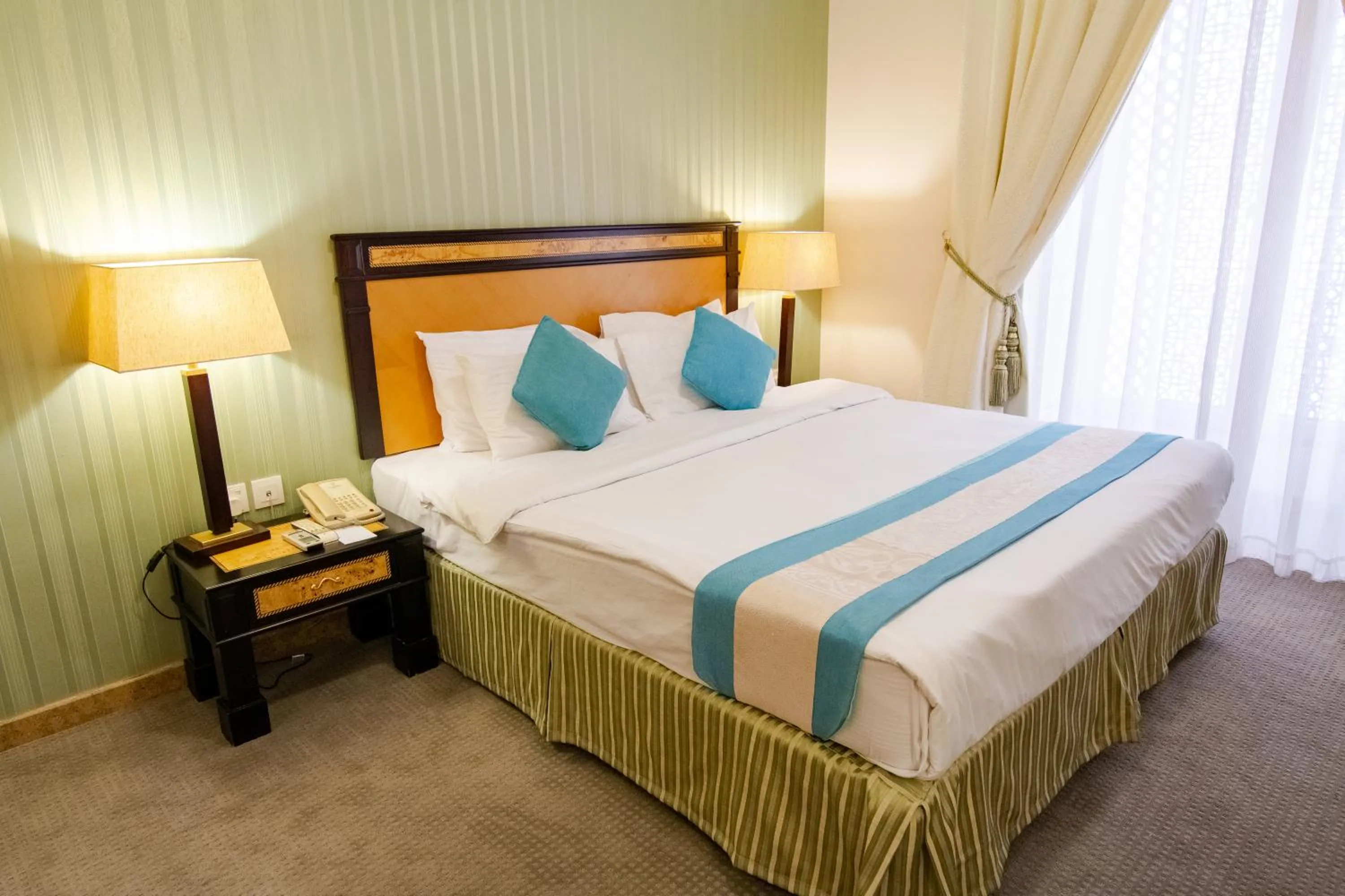 Bed in Garden Hotel Muscat By Royal Titan Group