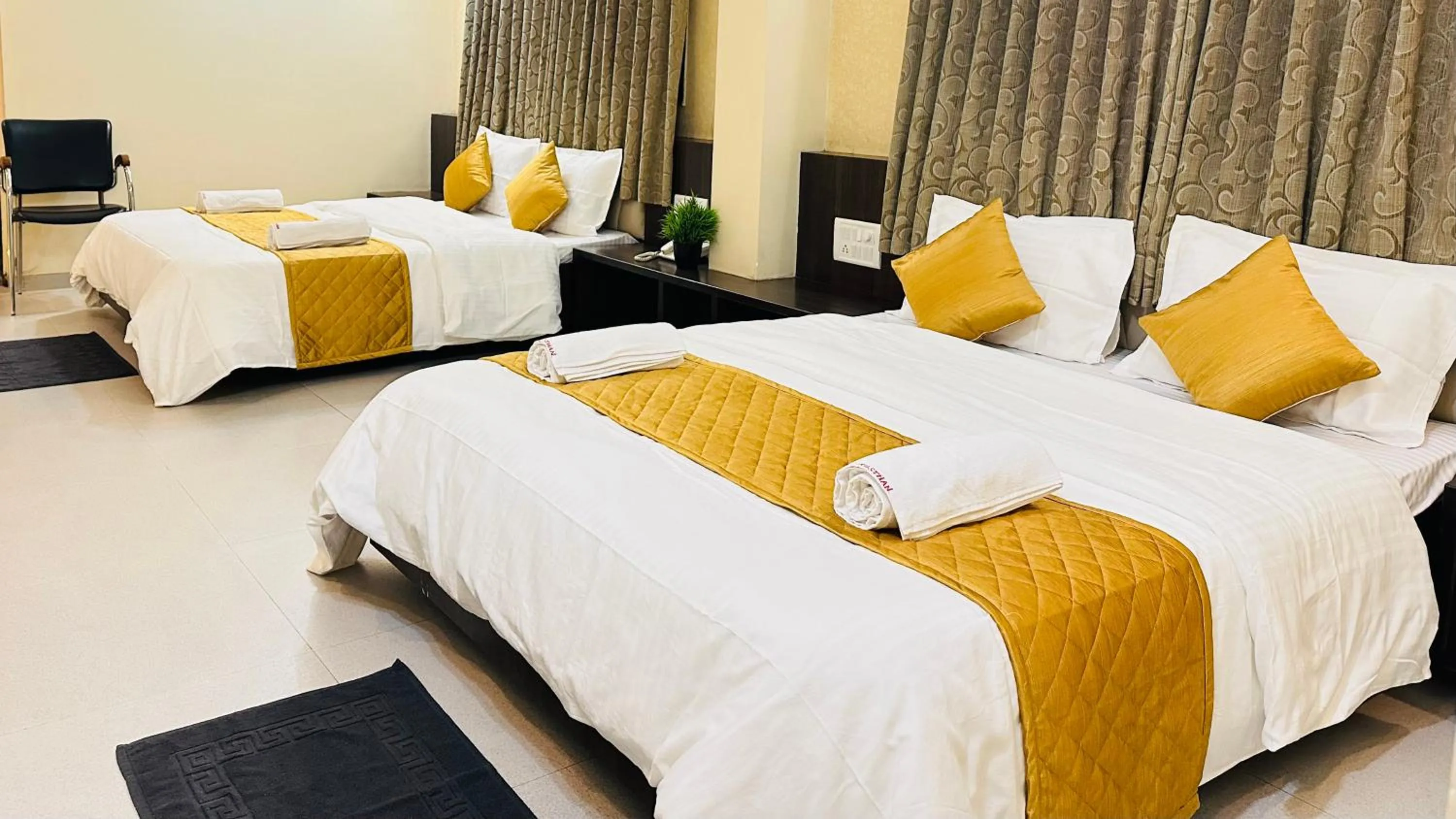 Bed in Hotel Sai Gurusthan