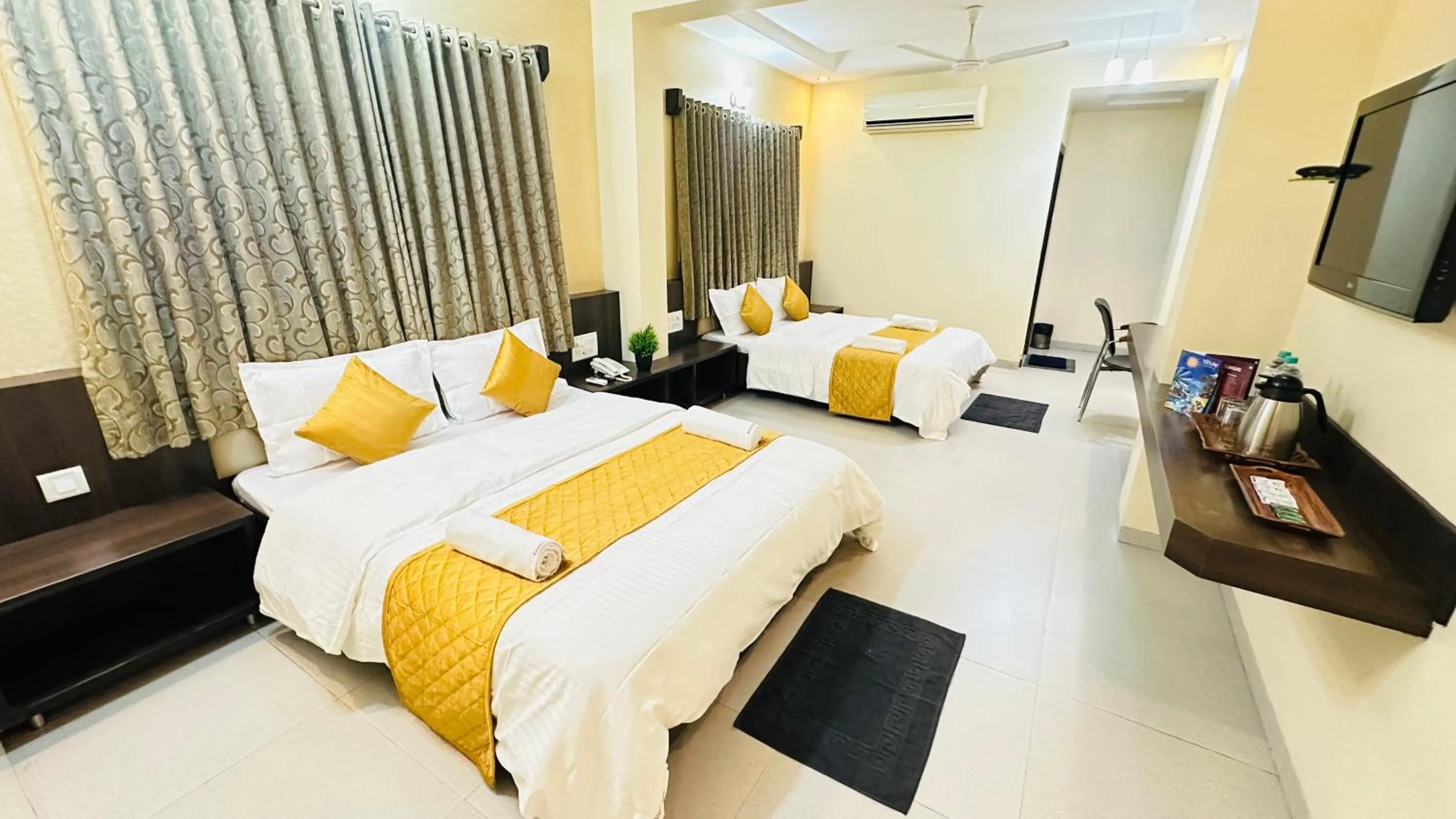 Bed in Hotel Sai Gurusthan