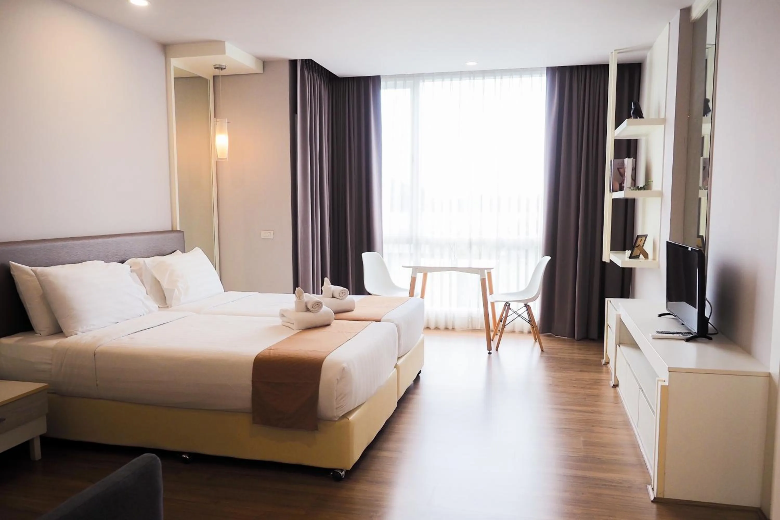 Bed in THE KANNAS Hotel & Serviced Apartment, Chiang Mai SHA Certified