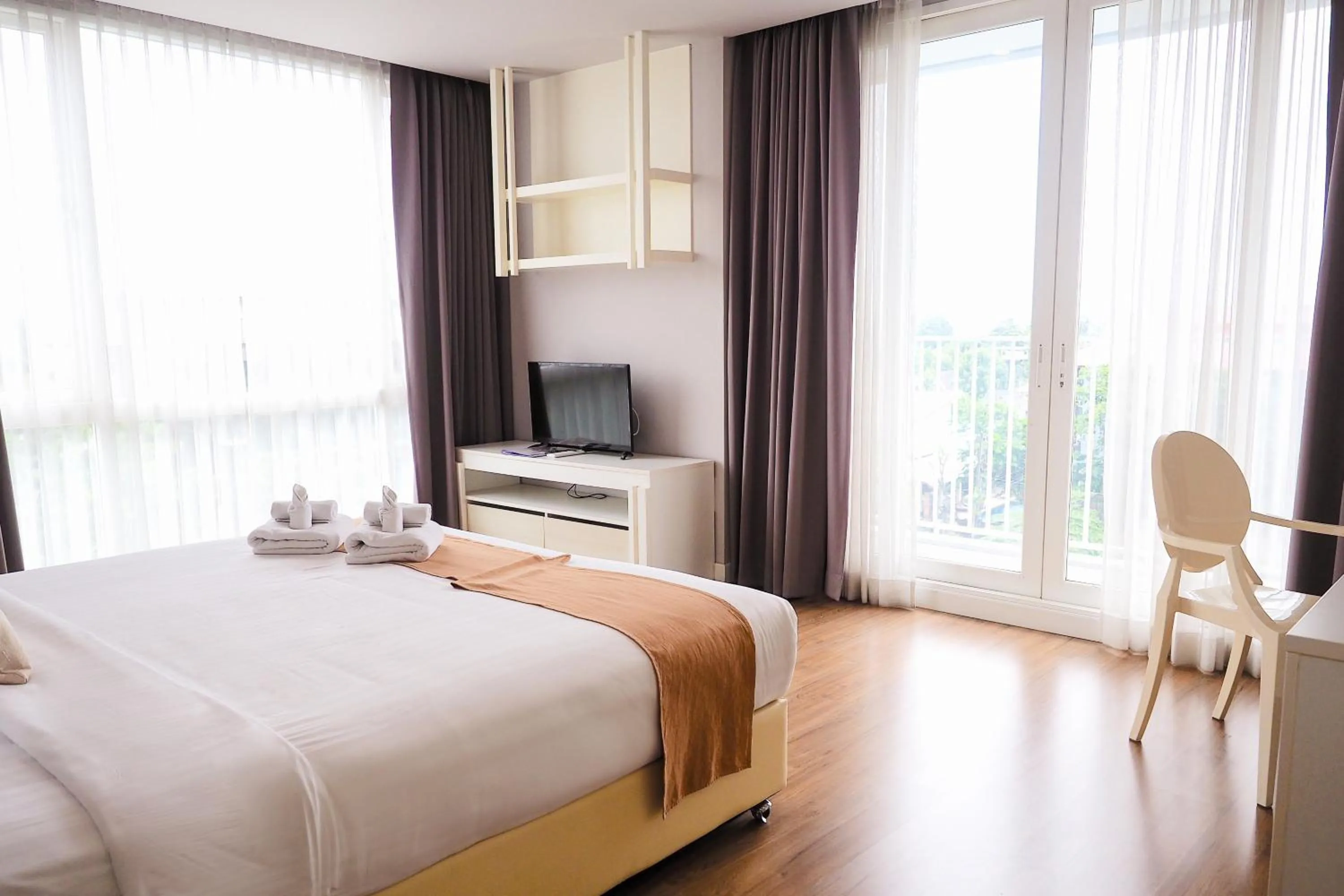 Bed in THE KANNAS Hotel & Serviced Apartment, Chiang Mai SHA Certified