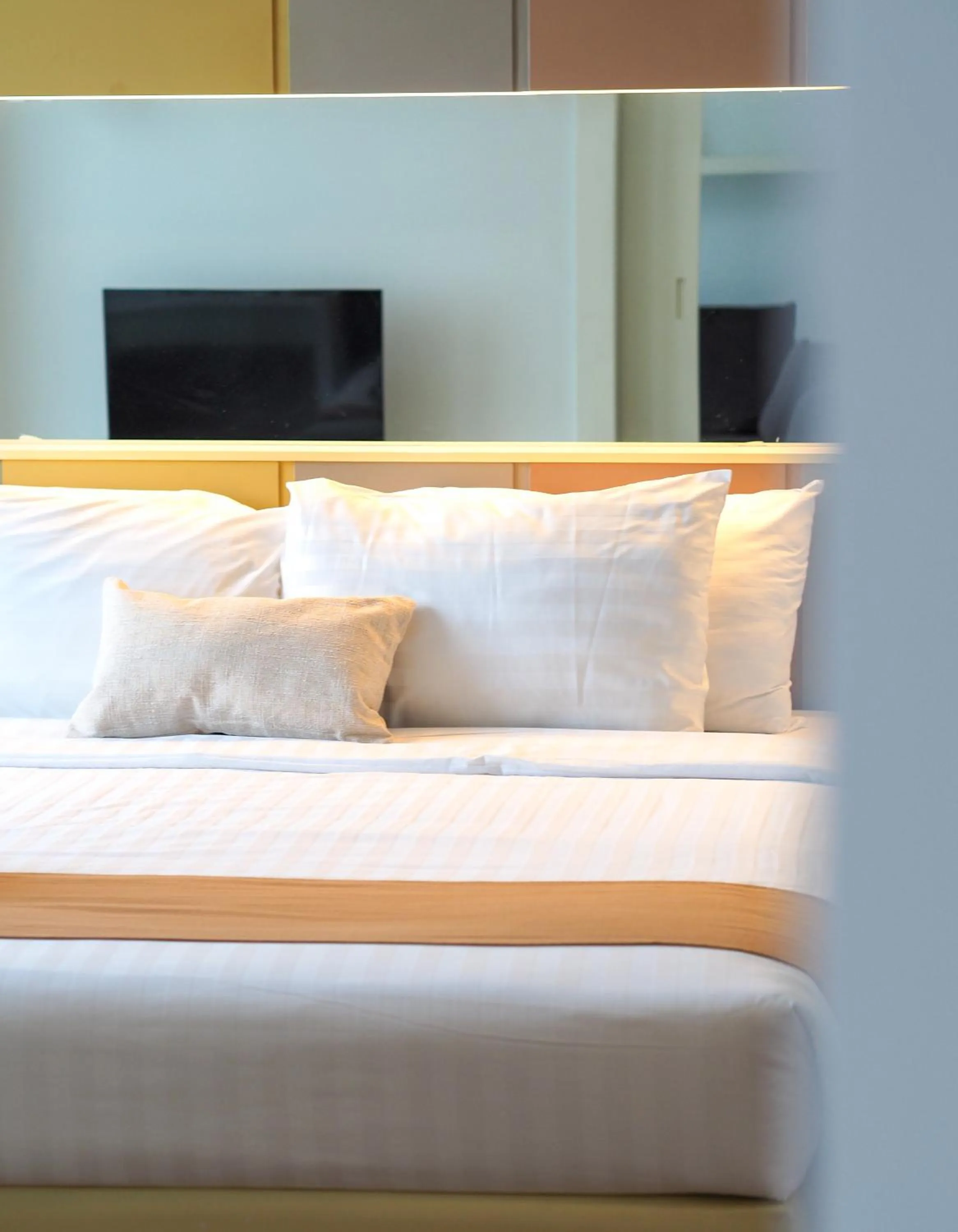 Bed in THE KANNAS Hotel & Serviced Apartment, Chiang Mai SHA Certified