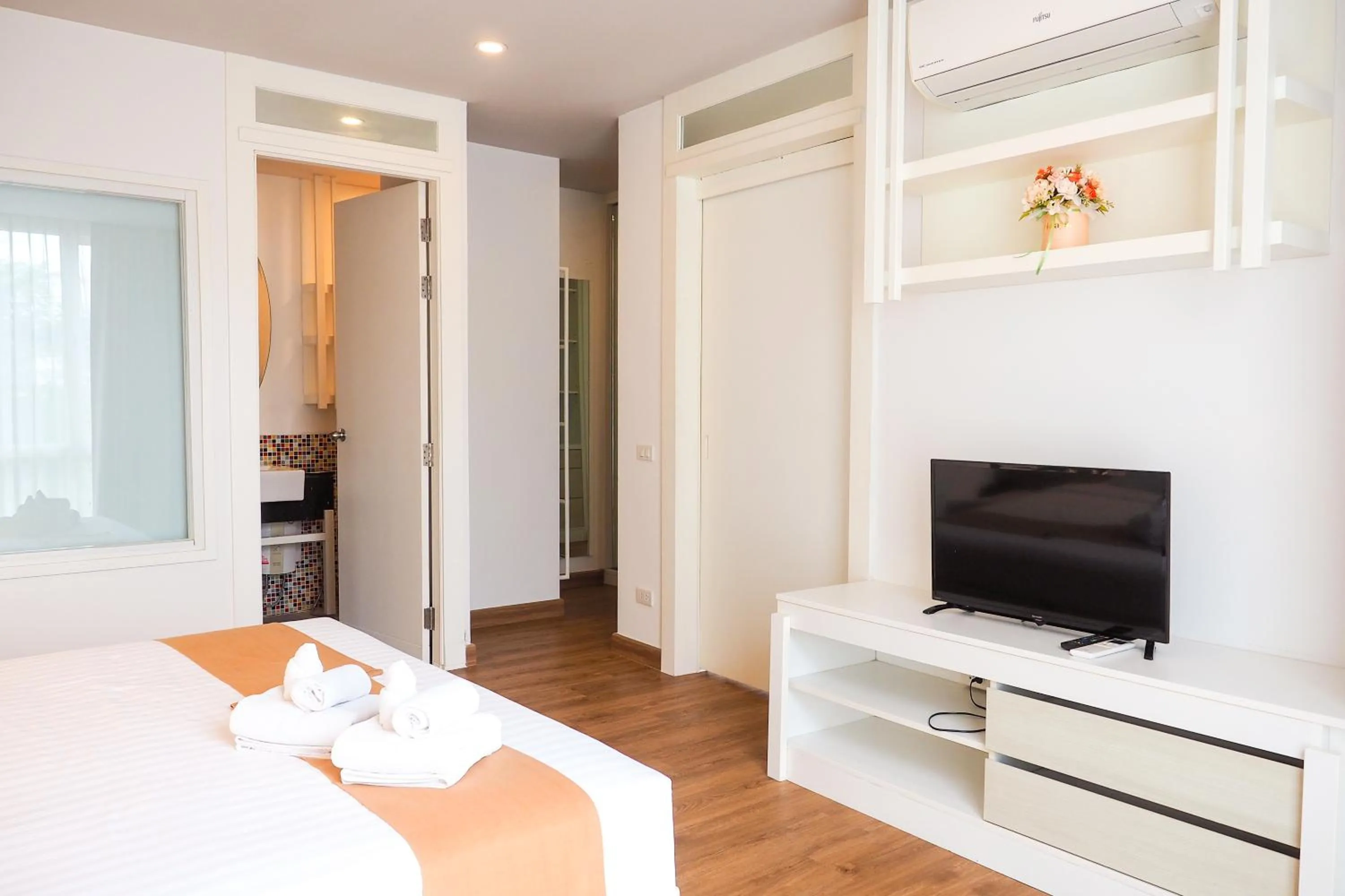 Bed in THE KANNAS Hotel & Serviced Apartment, Chiang Mai SHA Certified