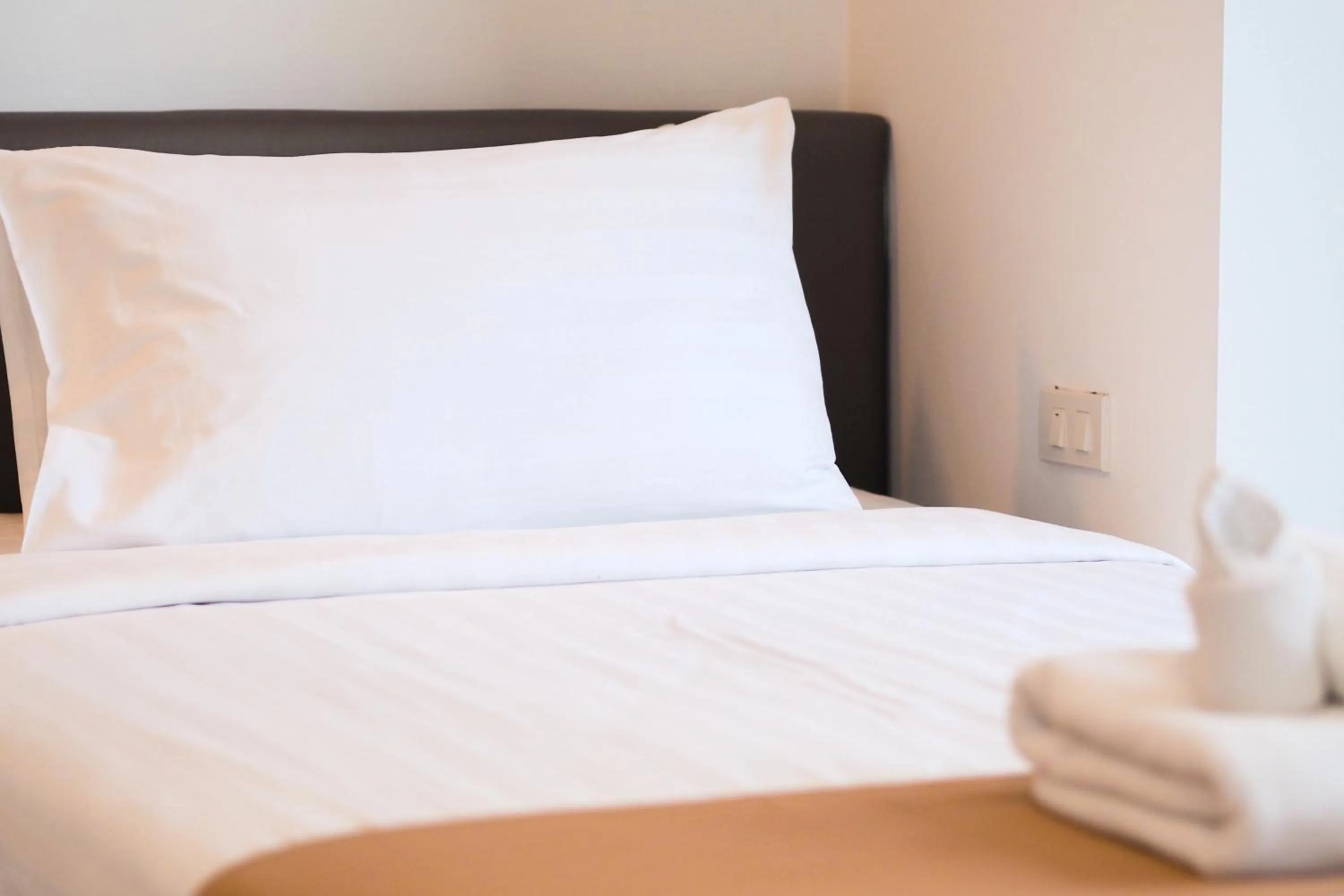 Bed in THE KANNAS Hotel & Serviced Apartment, Chiang Mai SHA Certified