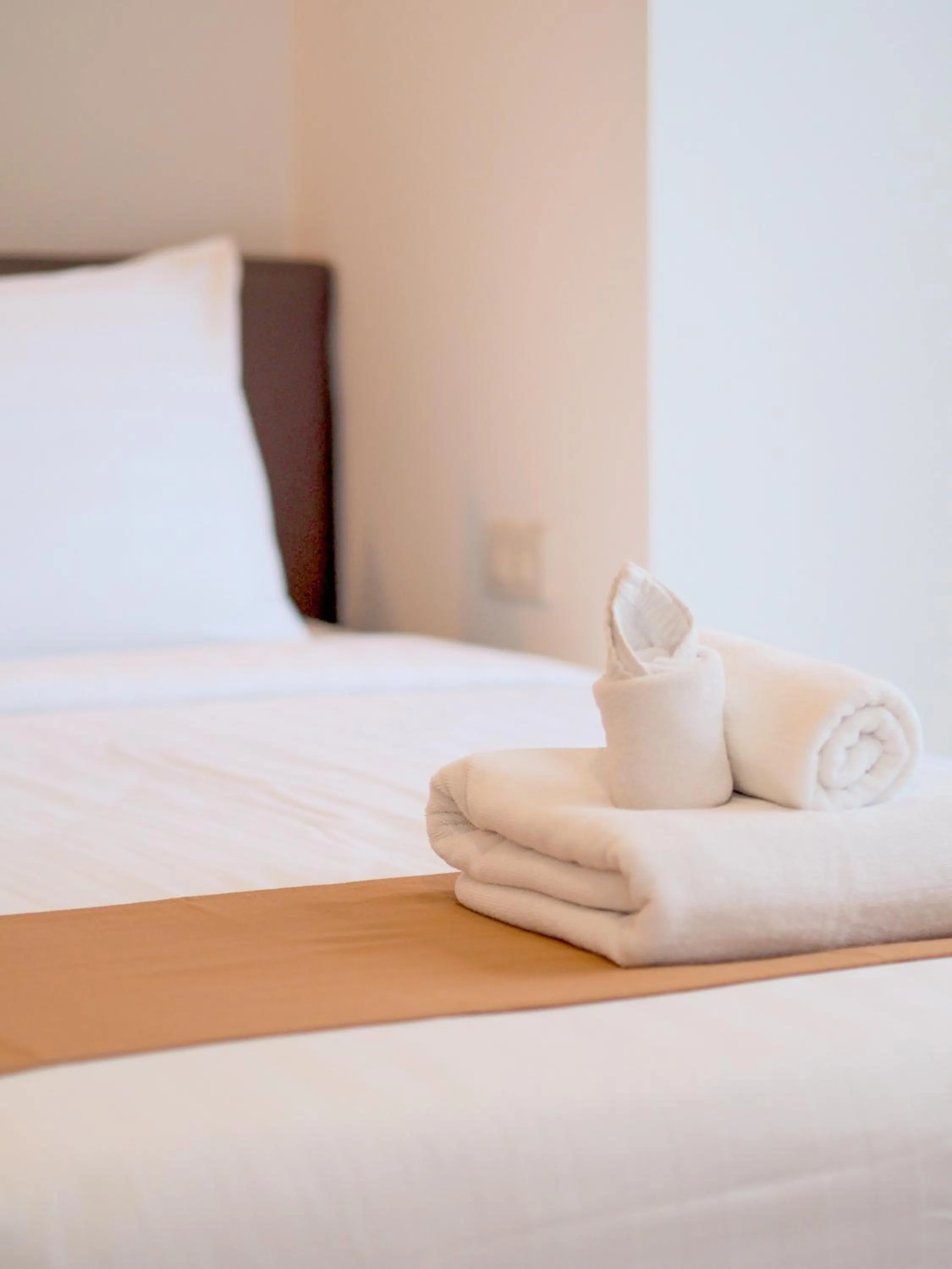 Bed in THE KANNAS Hotel & Serviced Apartment, Chiang Mai SHA Certified