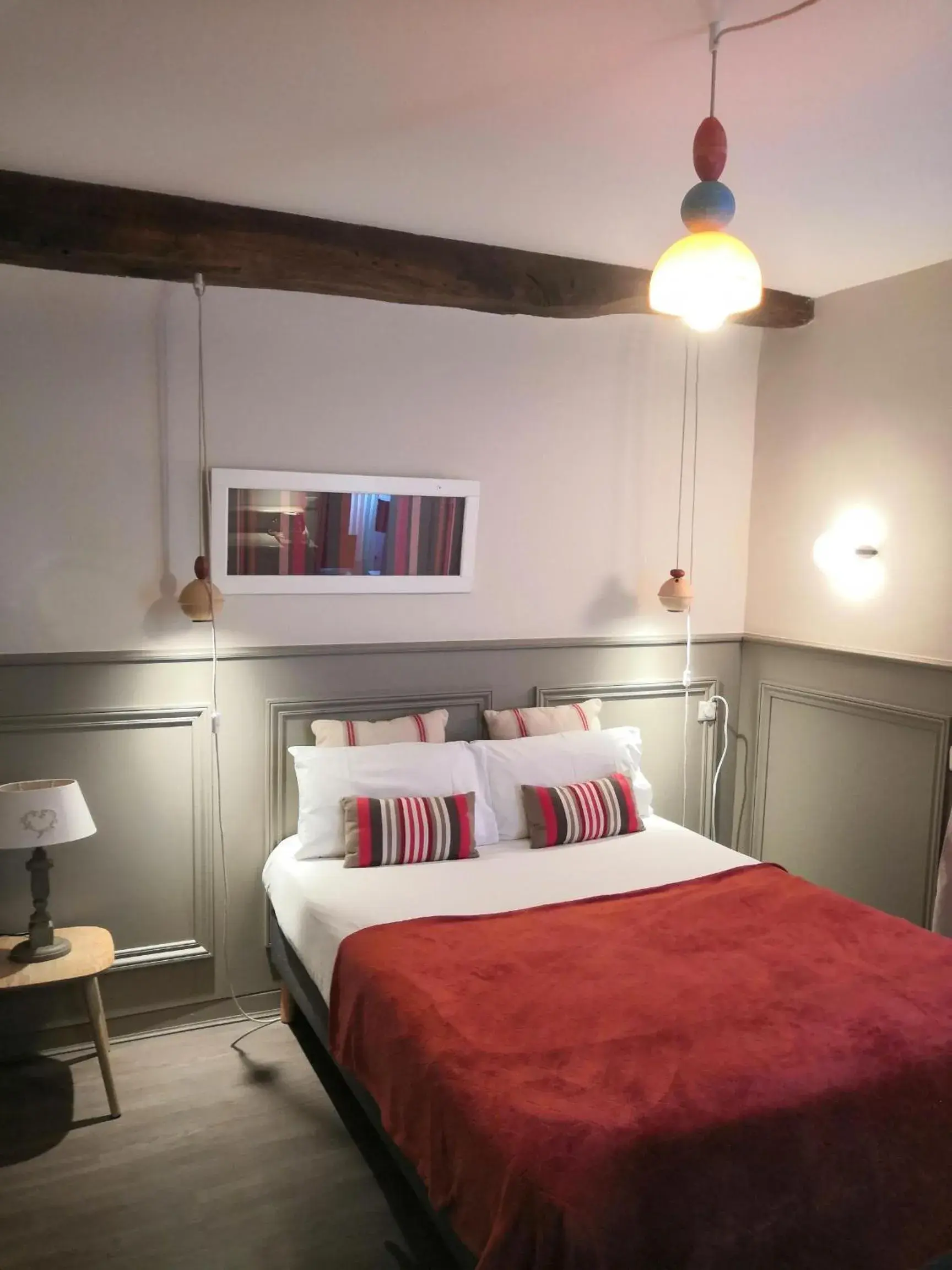 Bed in Hôtel La Caravelle Bed in Hôtel La Caravelle