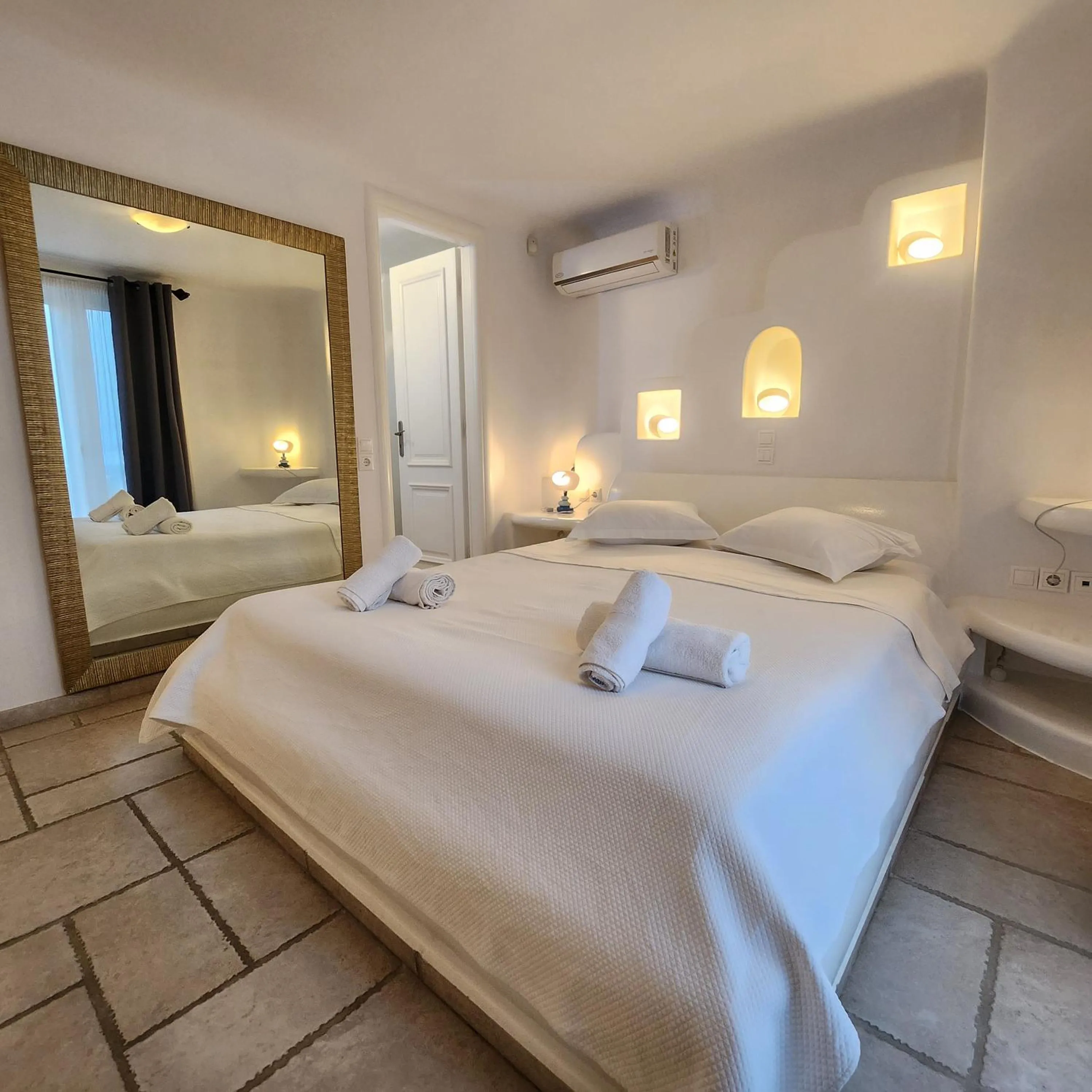 Bed in Mykonian Iros Suites & Villas