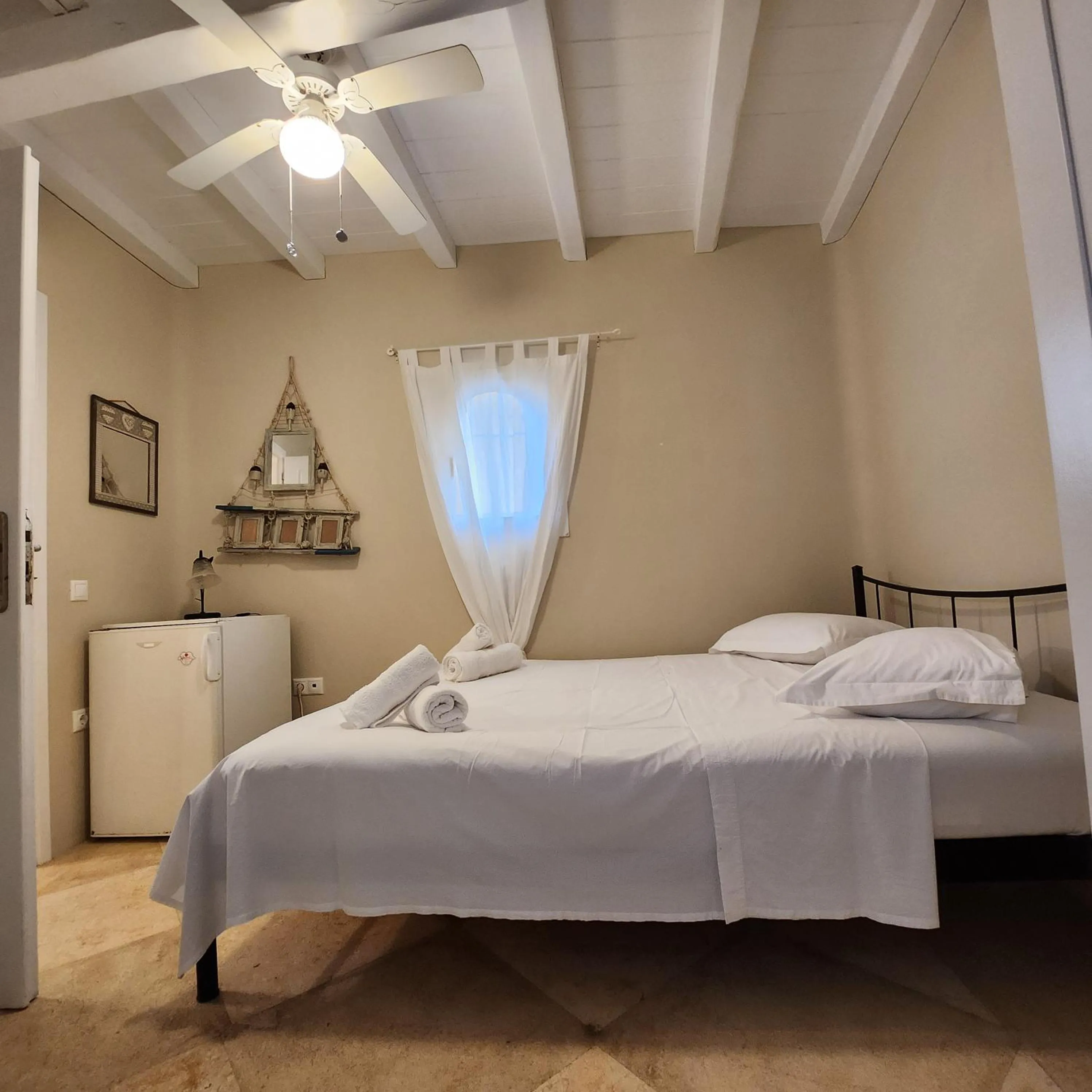 Bed in Mykonian Iros Suites & Villas