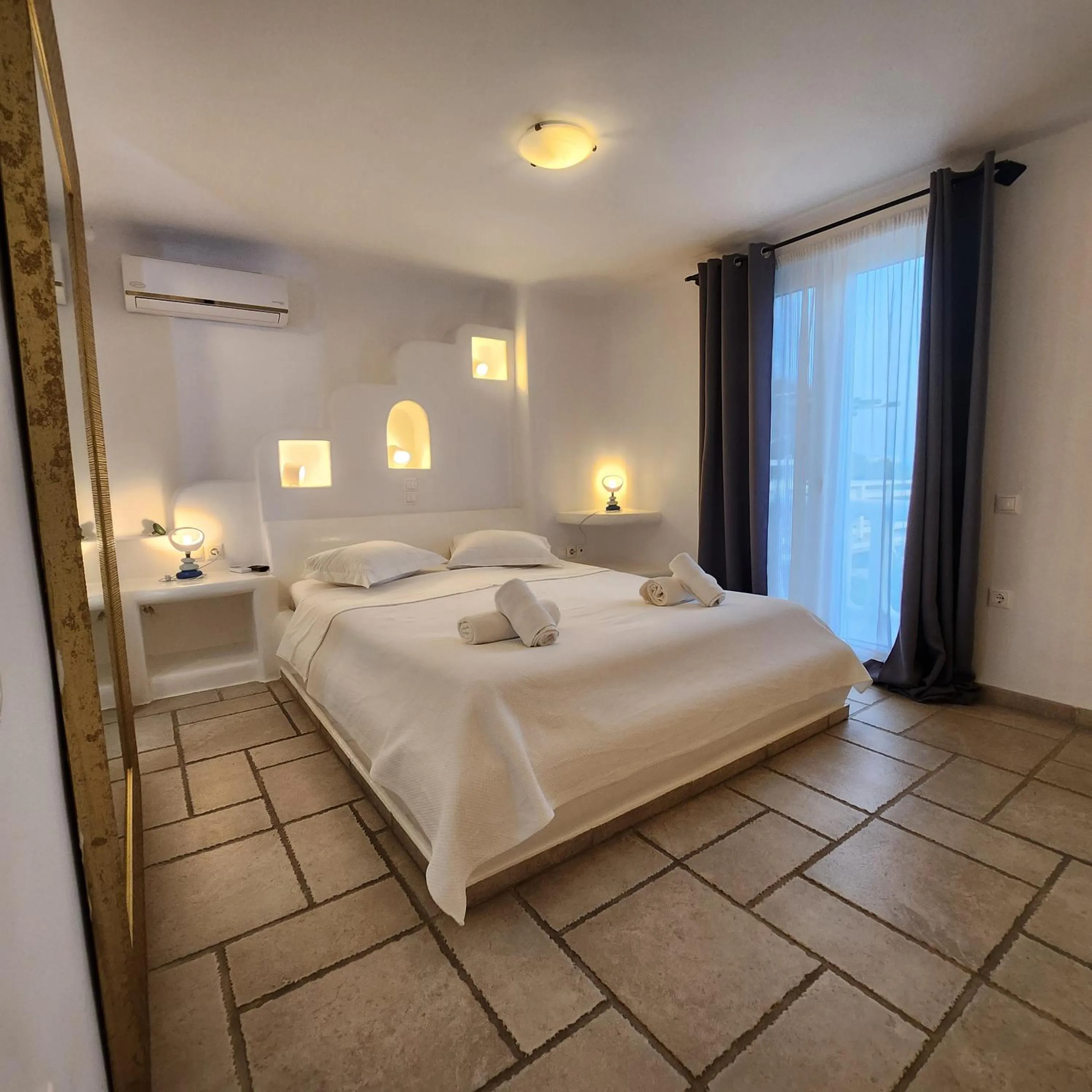 Bed in Mykonian Iros Suites & Villas