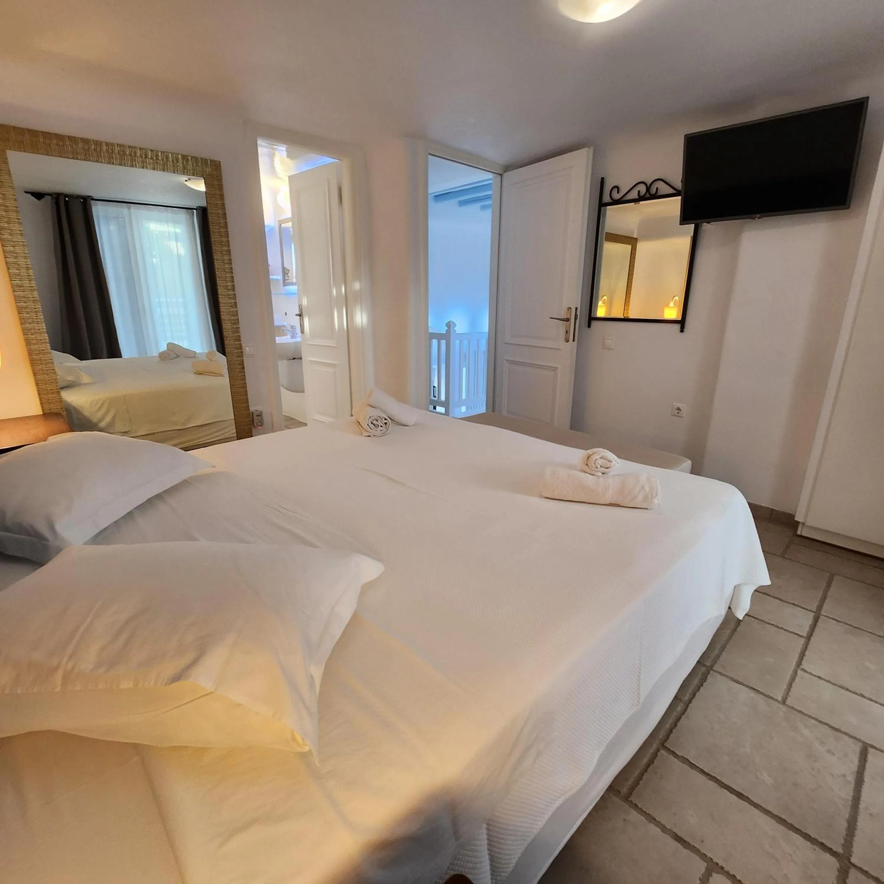 Bed in Mykonian Iros Suites & Villas