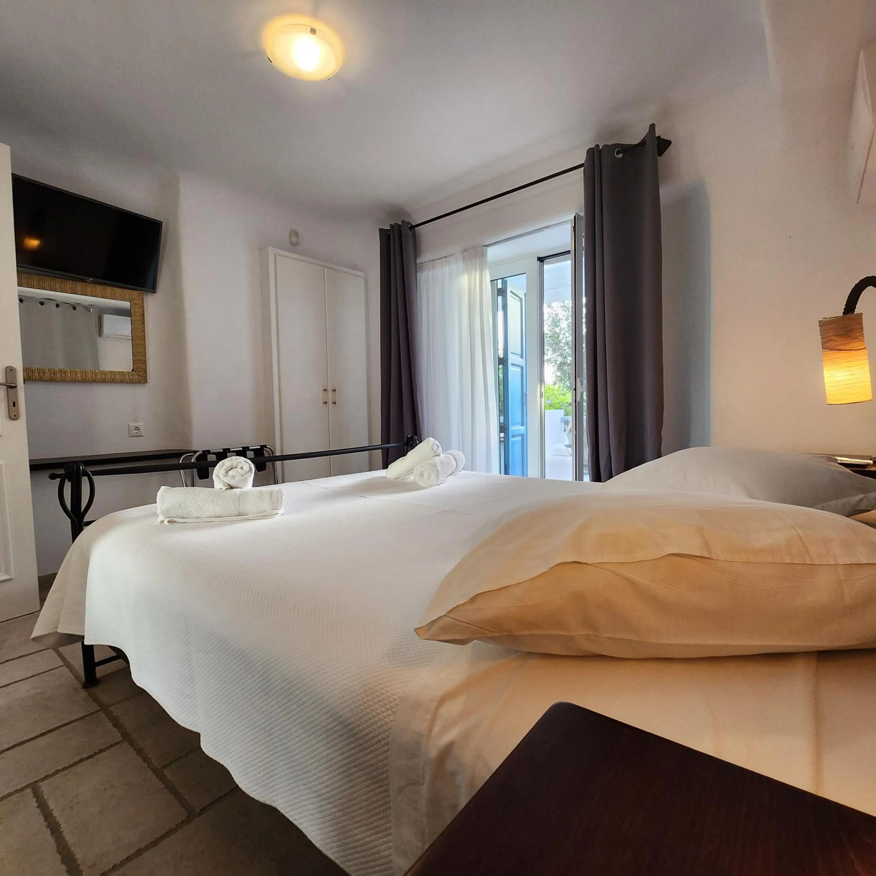 Bed in Mykonian Iros Suites & Villas