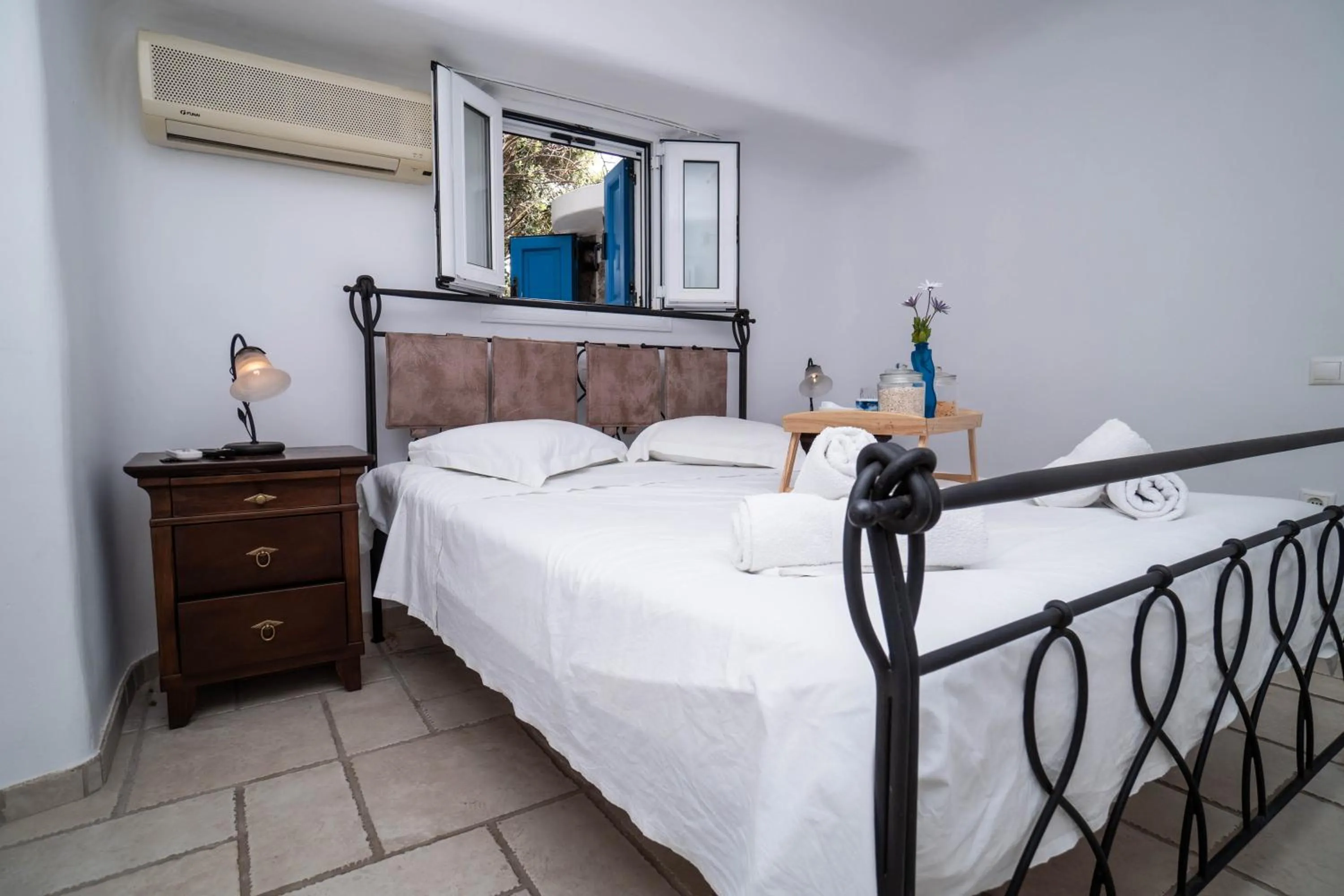 Bed in Mykonian Iros Suites & Villas