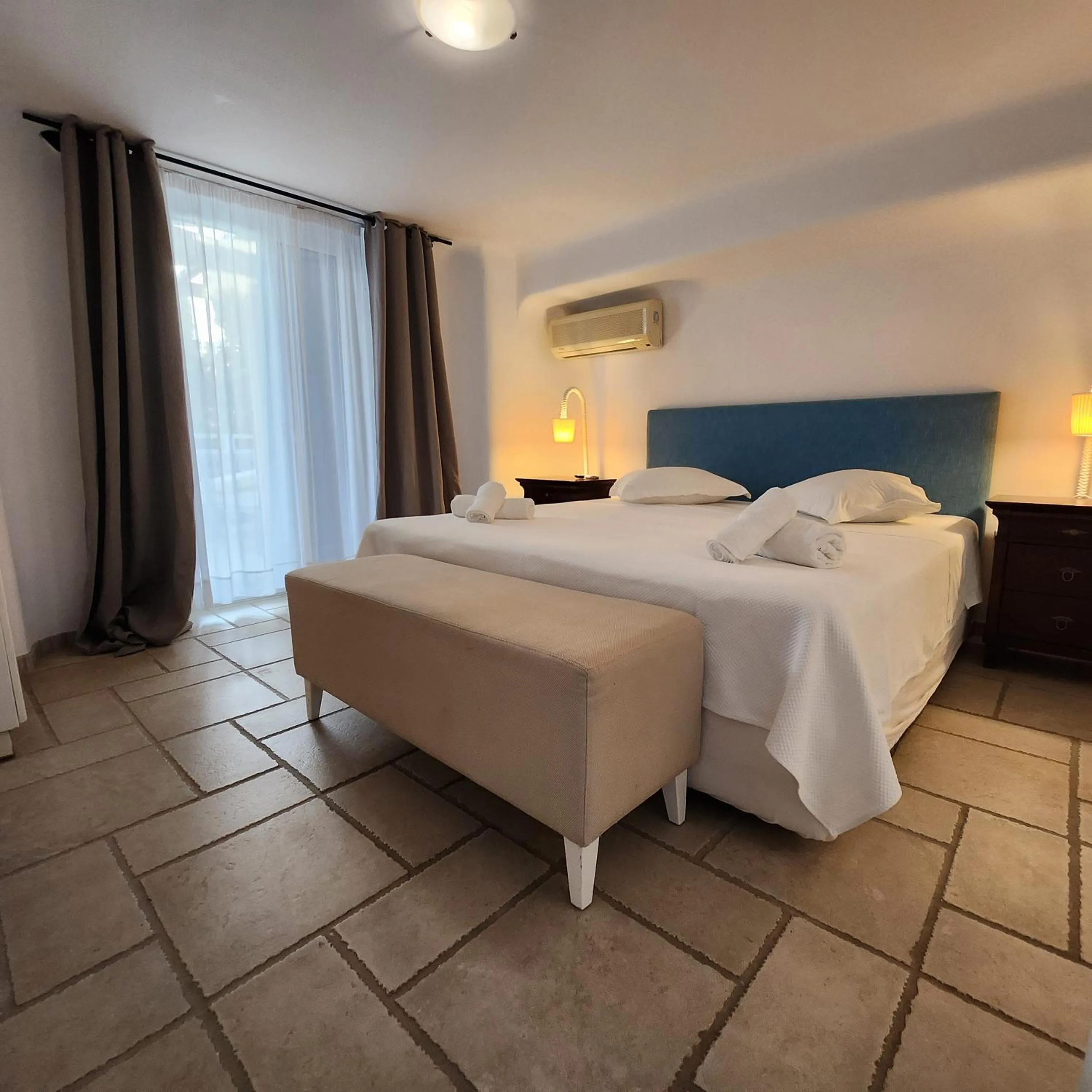 Bed in Mykonian Iros Suites & Villas