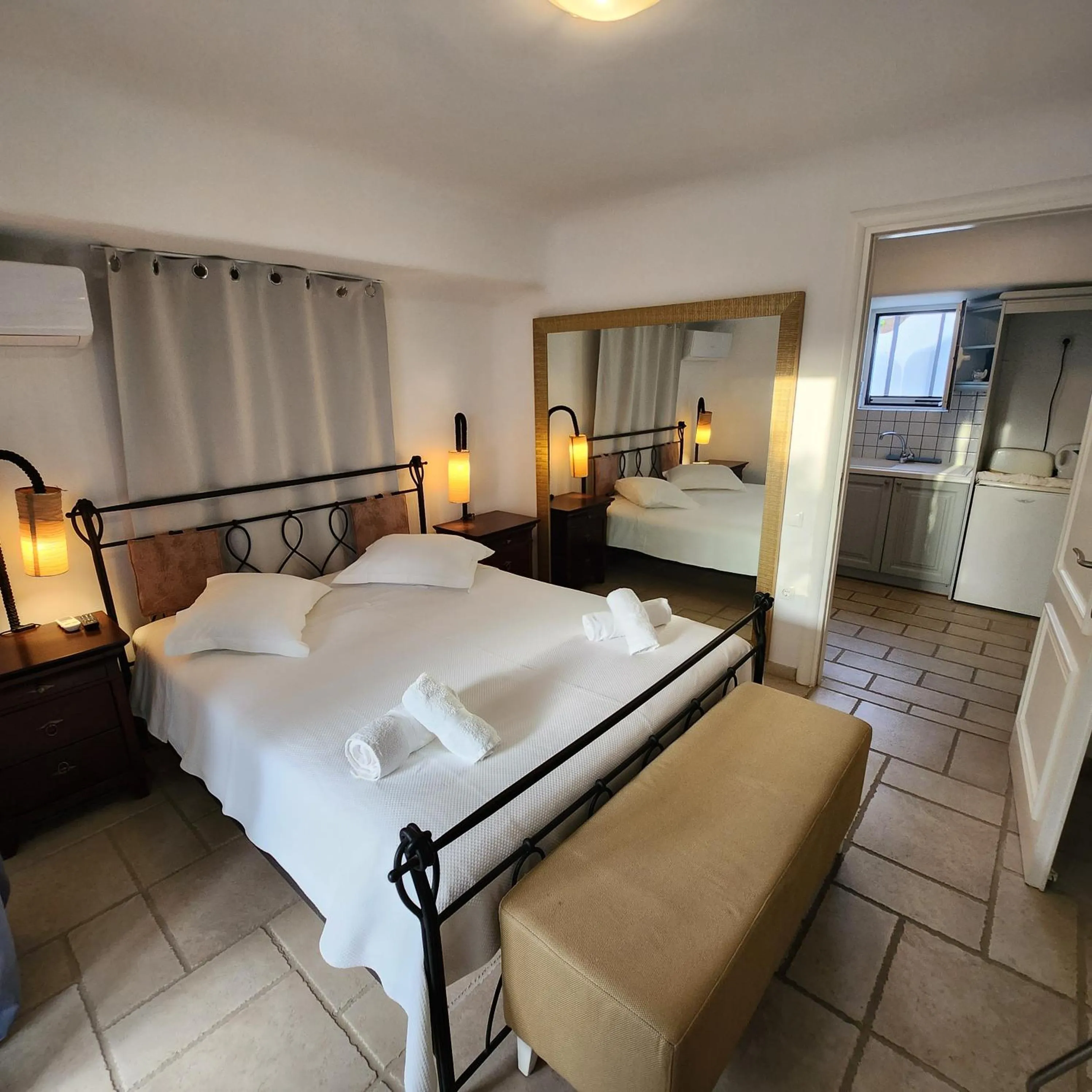 Bed in Mykonian Iros Suites & Villas