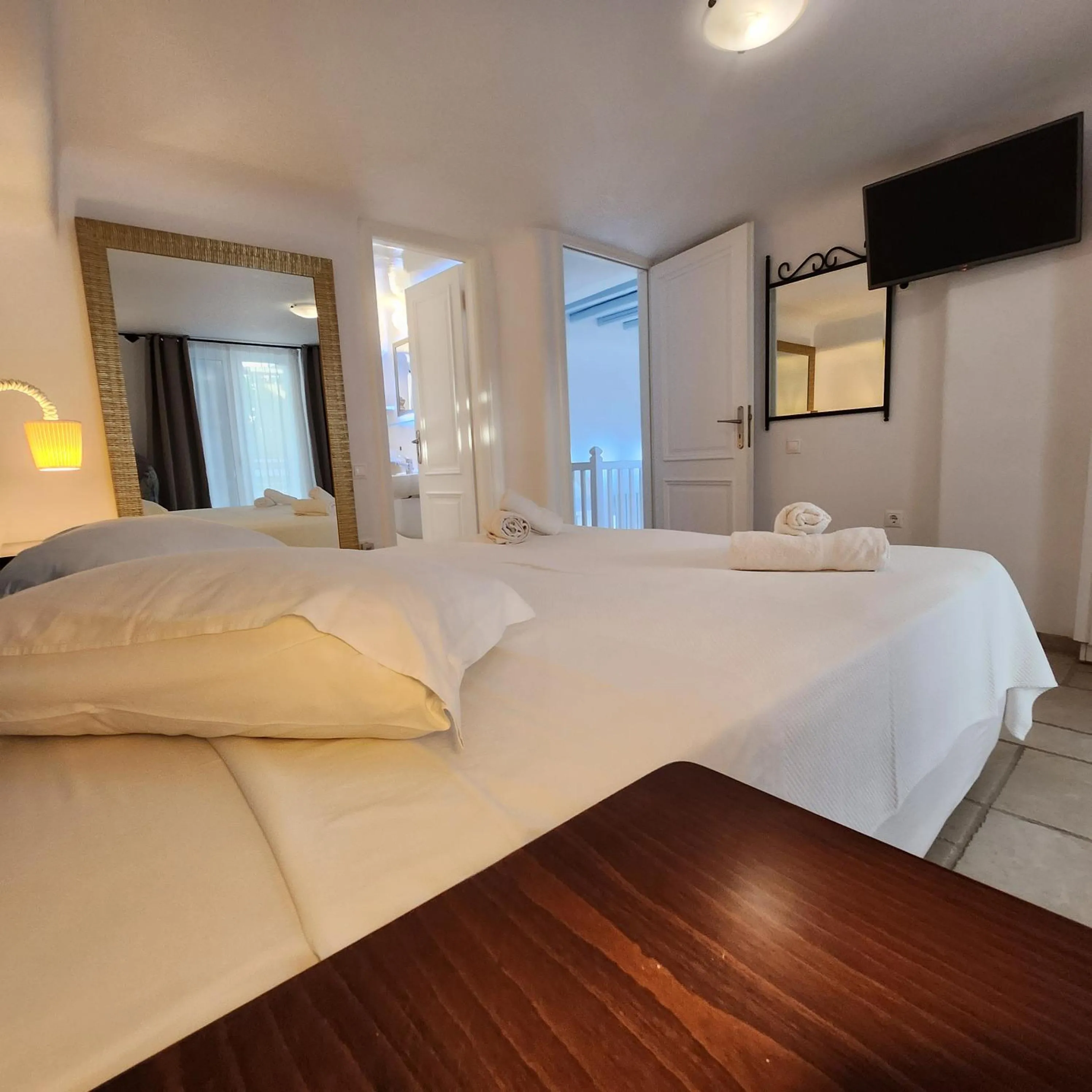 Bed in Mykonian Iros Suites & Villas