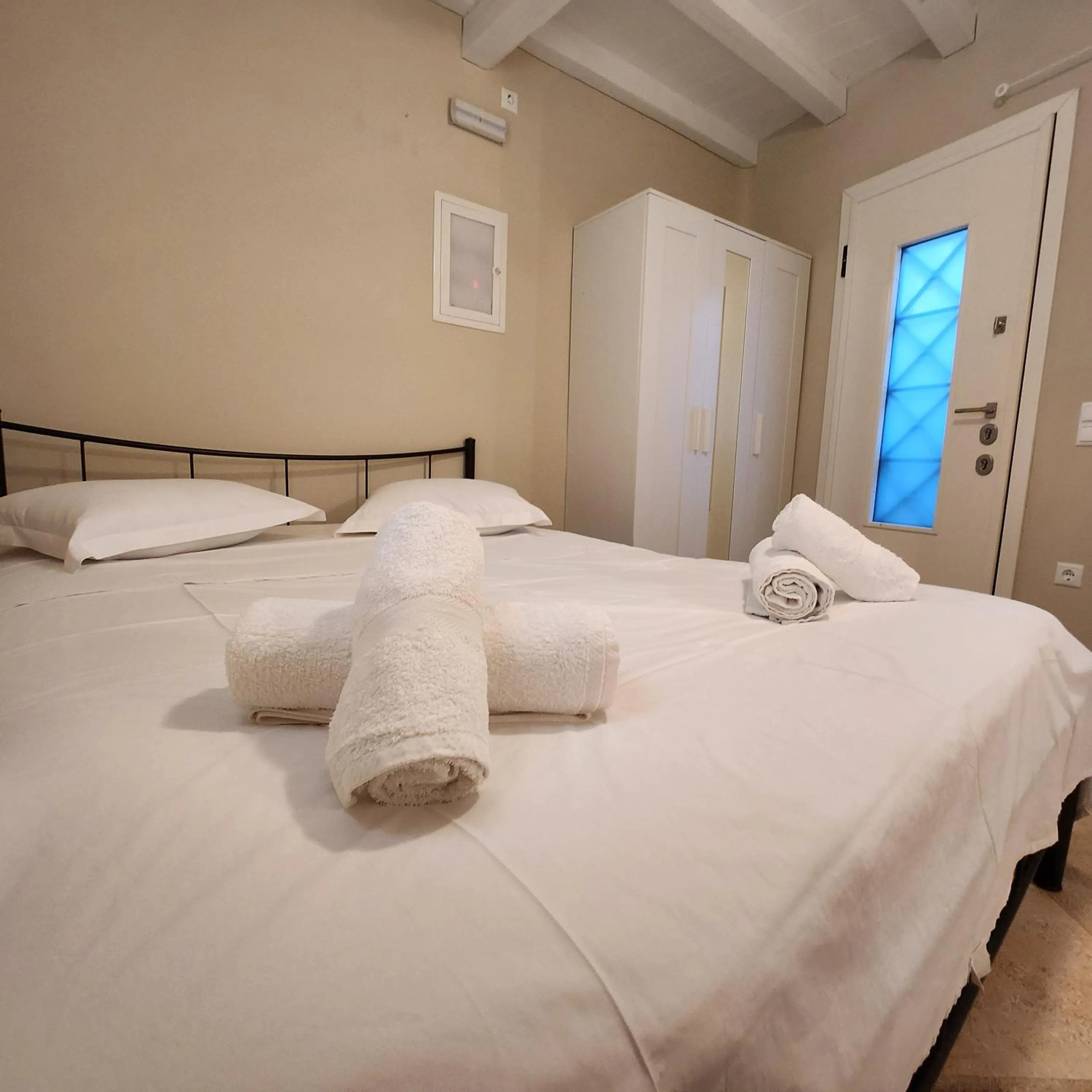 Bed in Mykonian Iros Suites & Villas