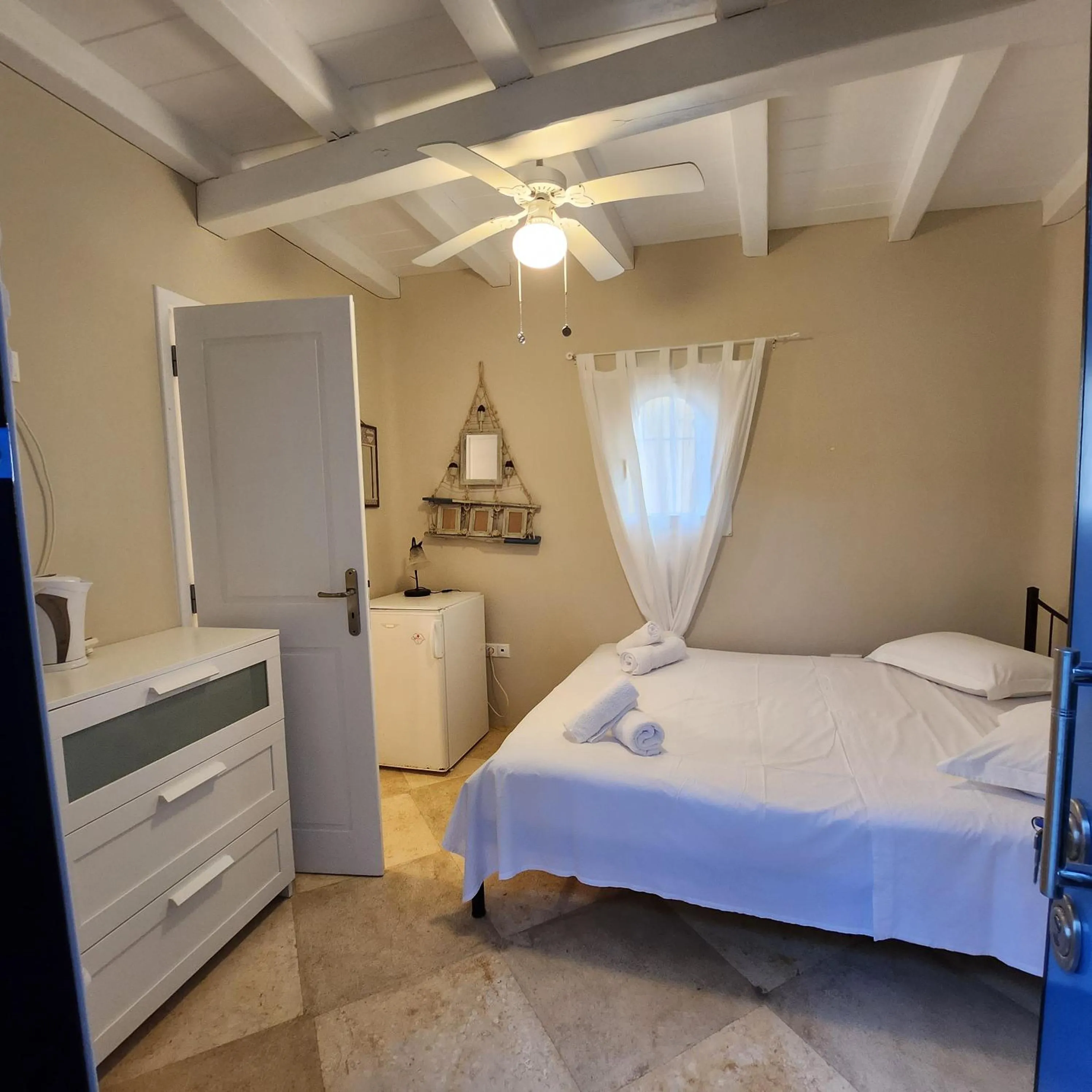 Bed in Mykonian Iros Suites & Villas