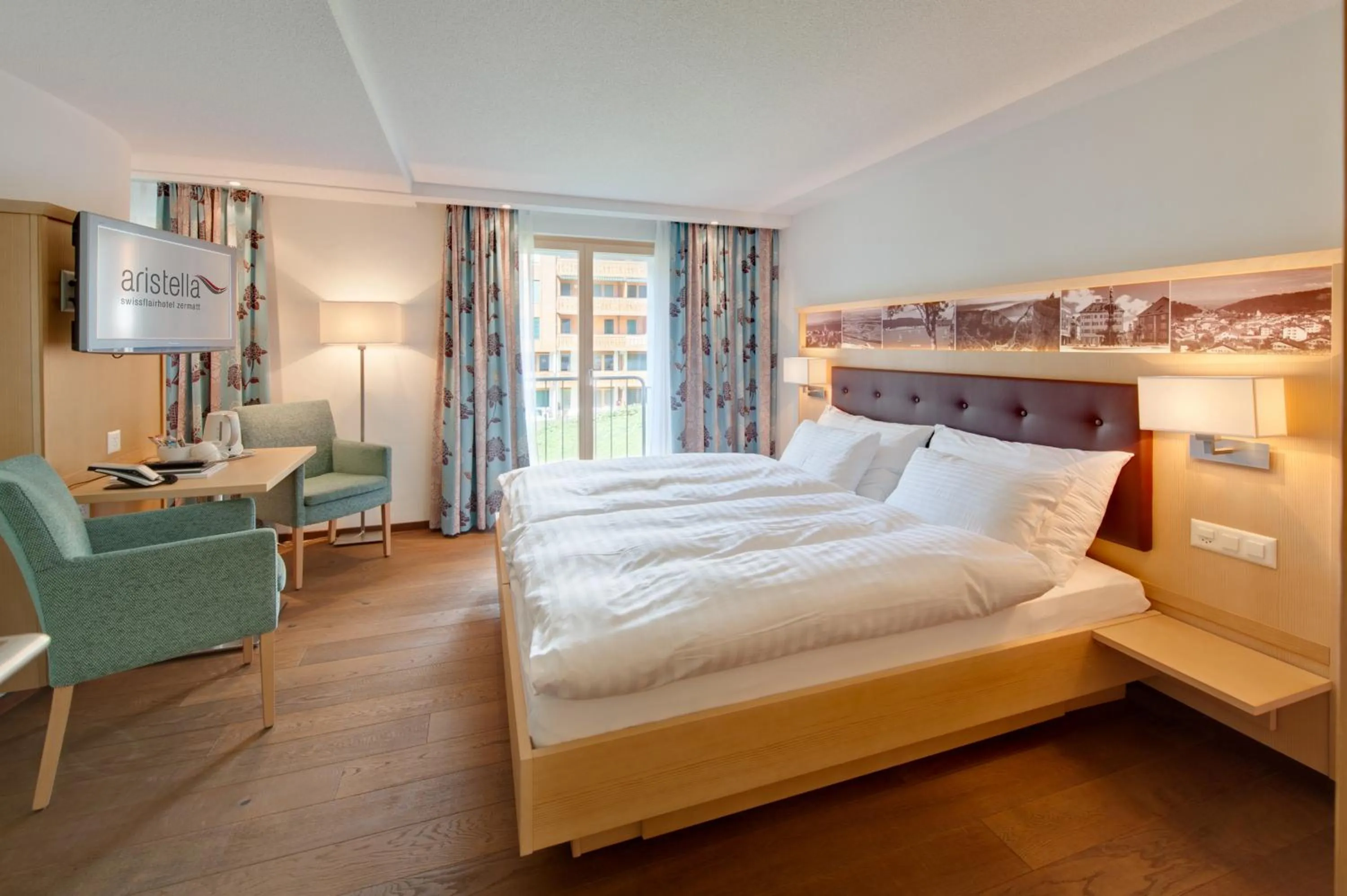 Bed in Hotel Aristella Swissflair