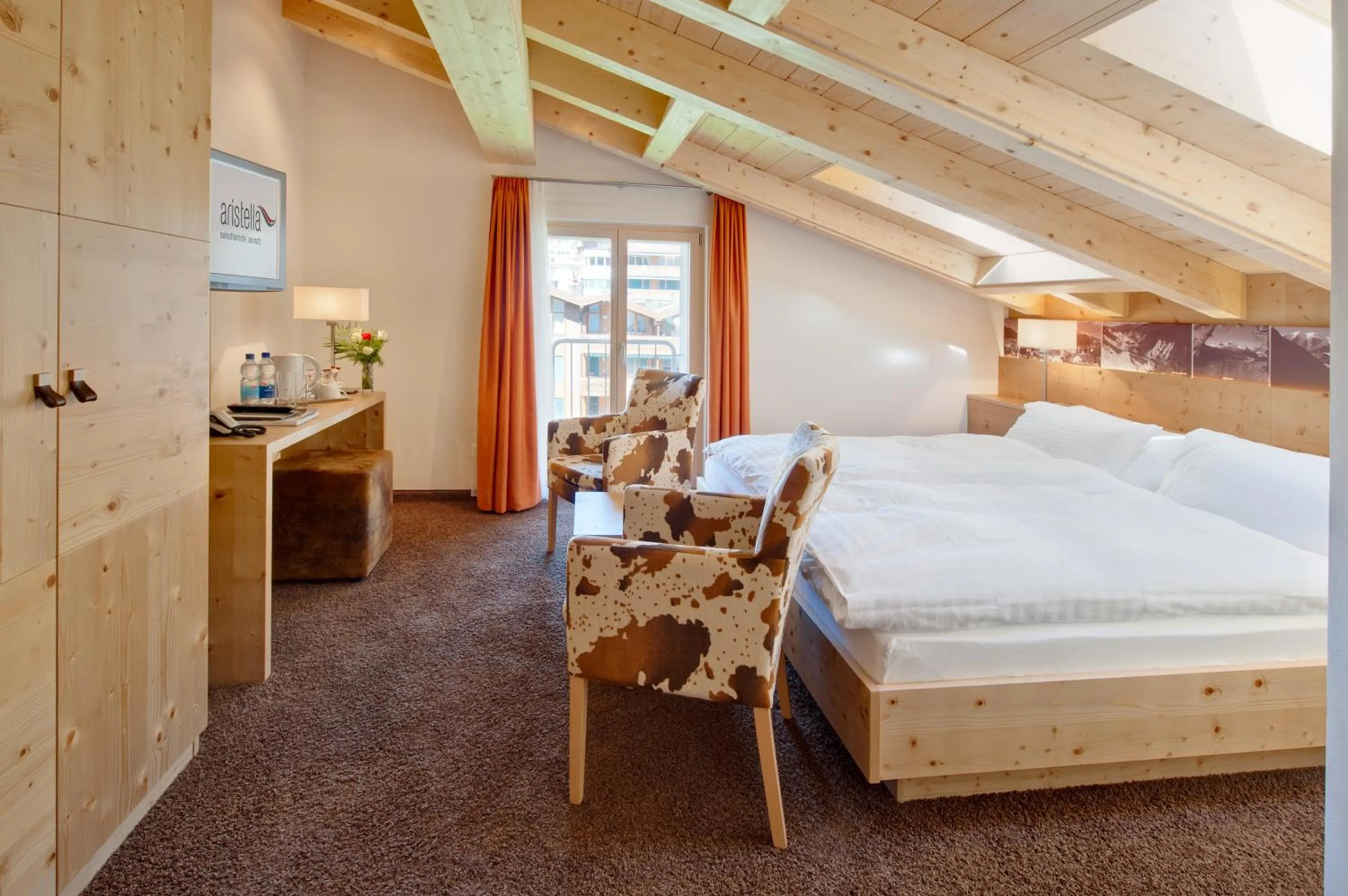 Bed in Hotel Aristella Swissflair