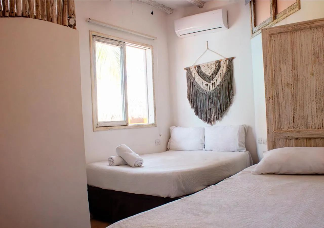 Bed in Holbox Dream Beachfront Hotel