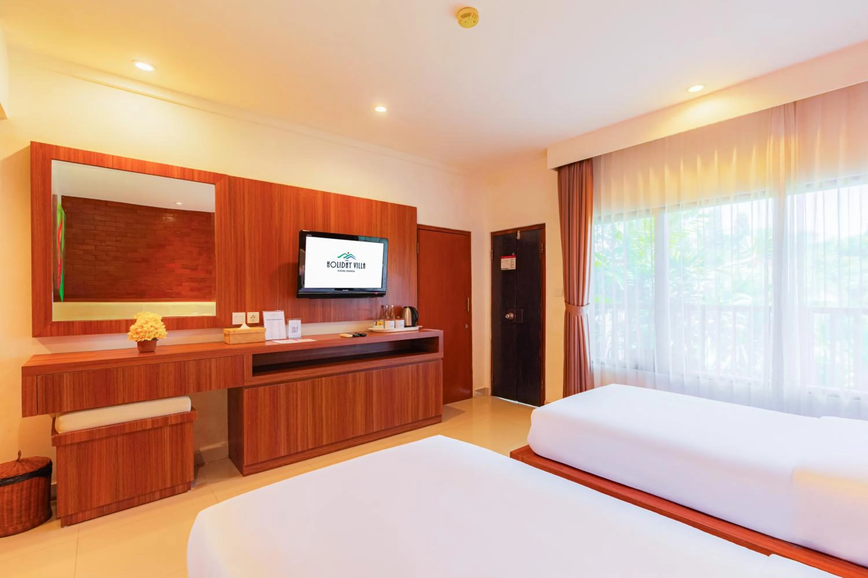 Bed in Wina Holiday Villa Kuta Bali