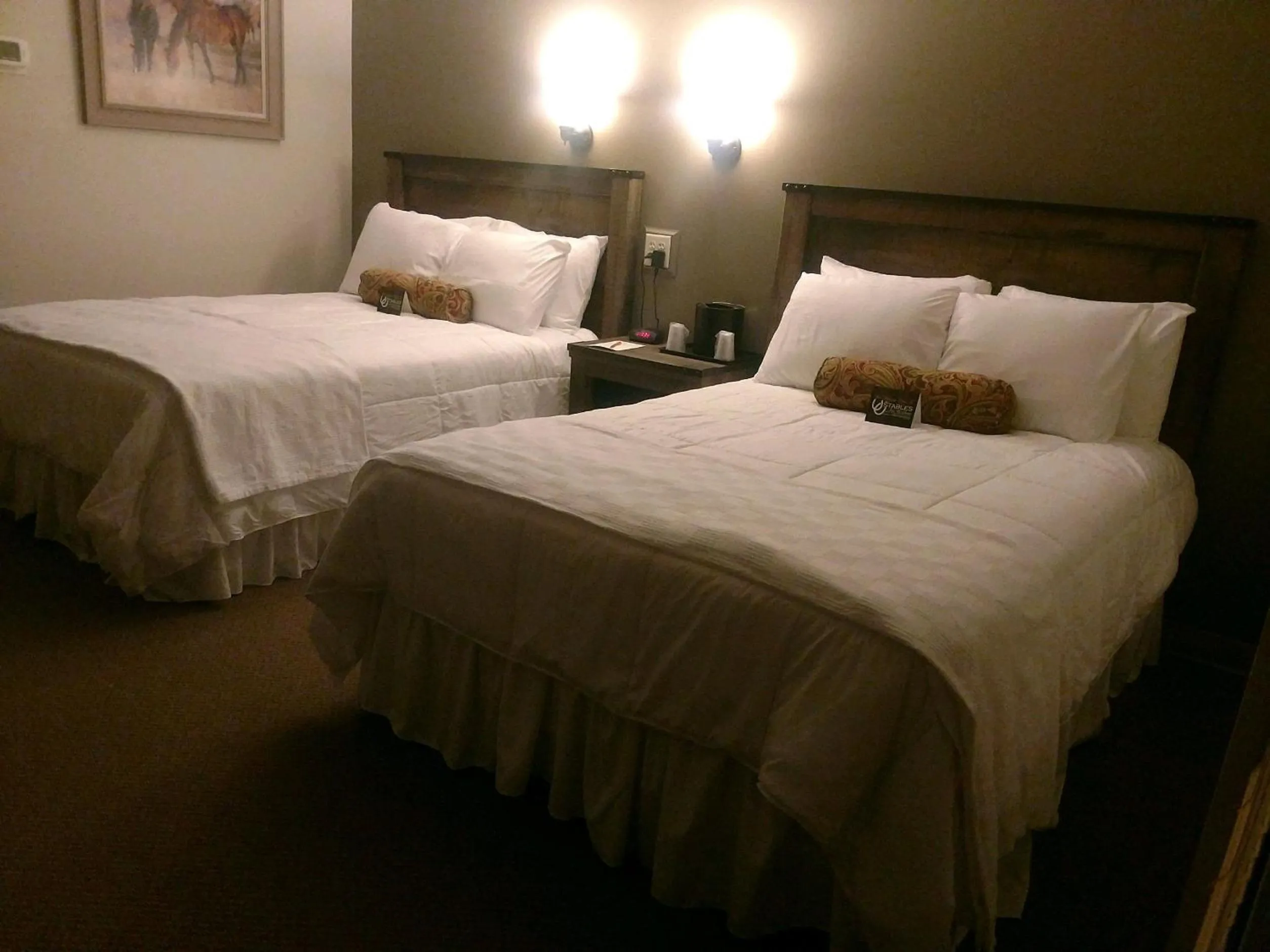 Bedroom, Bed in The Stables Inn & Suites