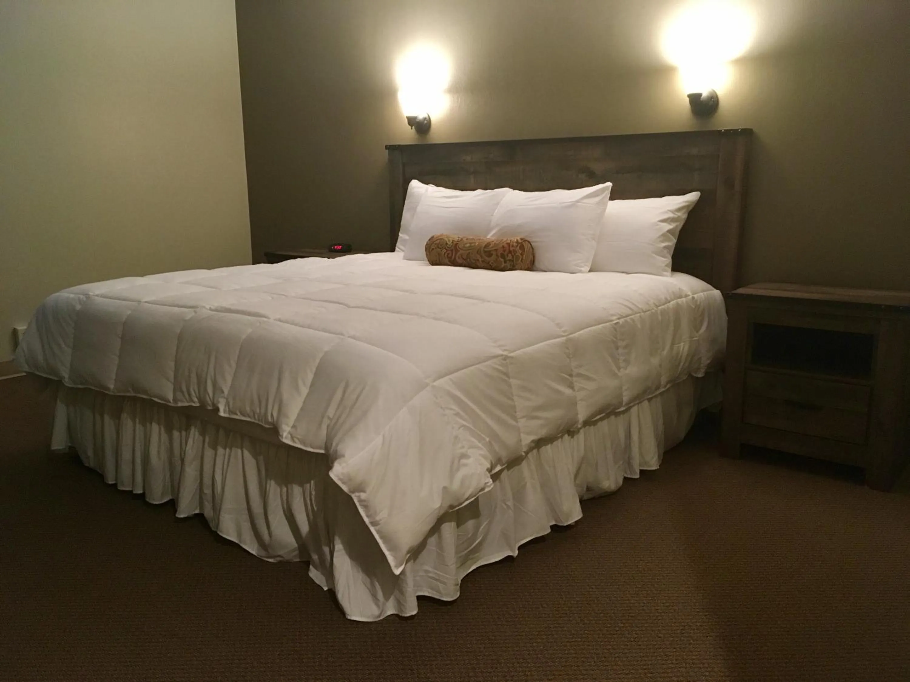 Bedroom, Bed in The Stables Inn & Suites