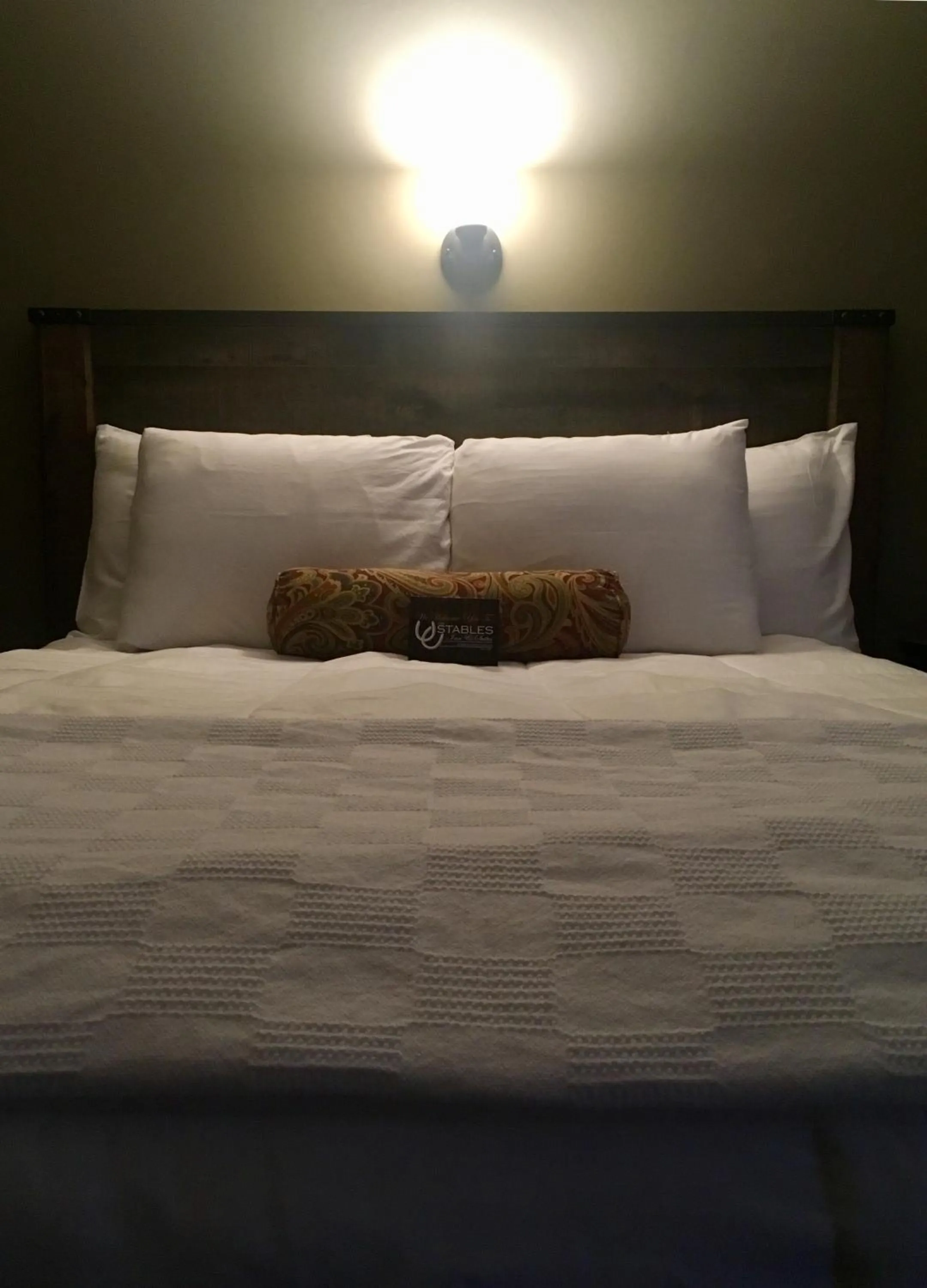 Bed in The Stables Inn & Suites