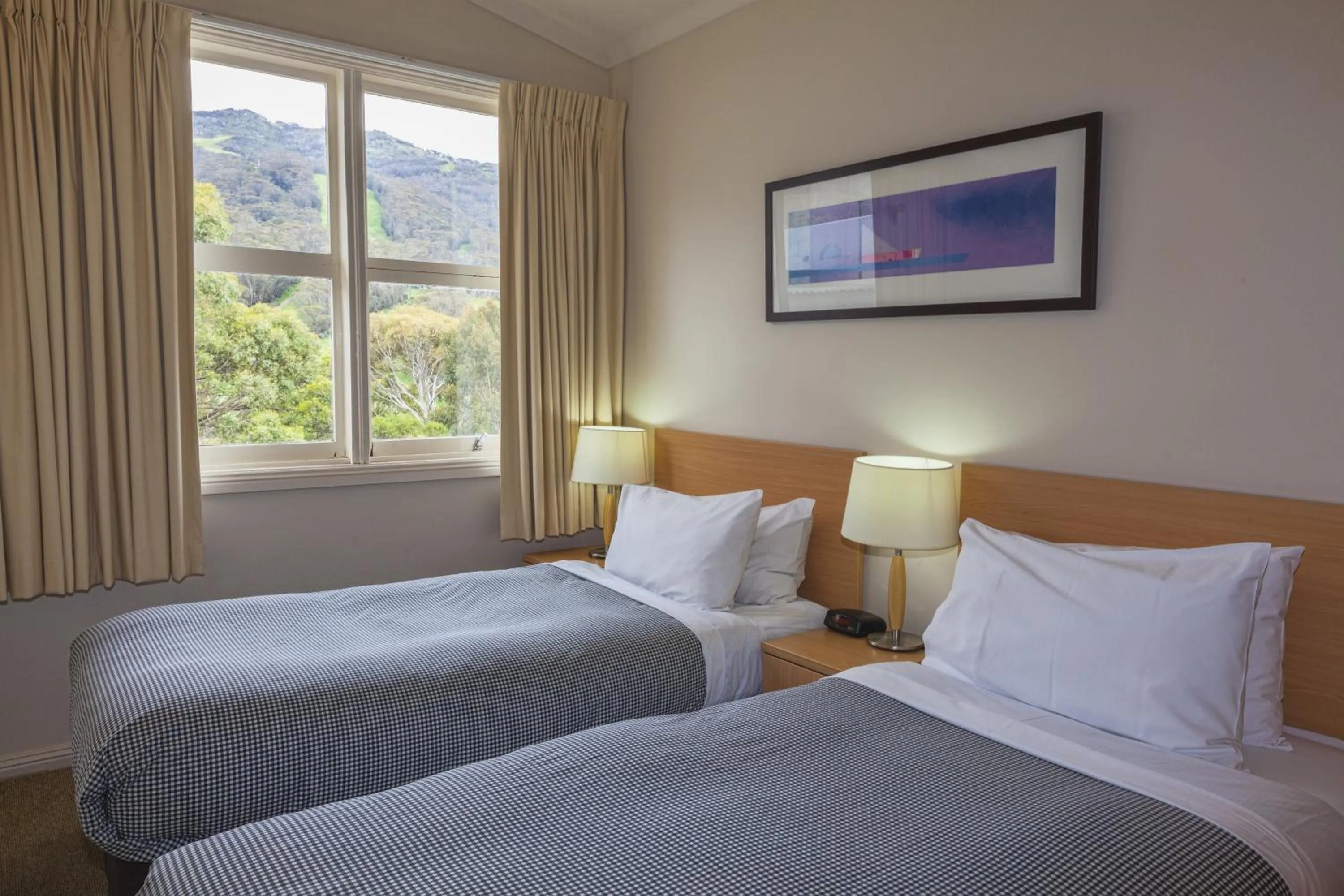 Bed in The Denman Hotel in Thredbo