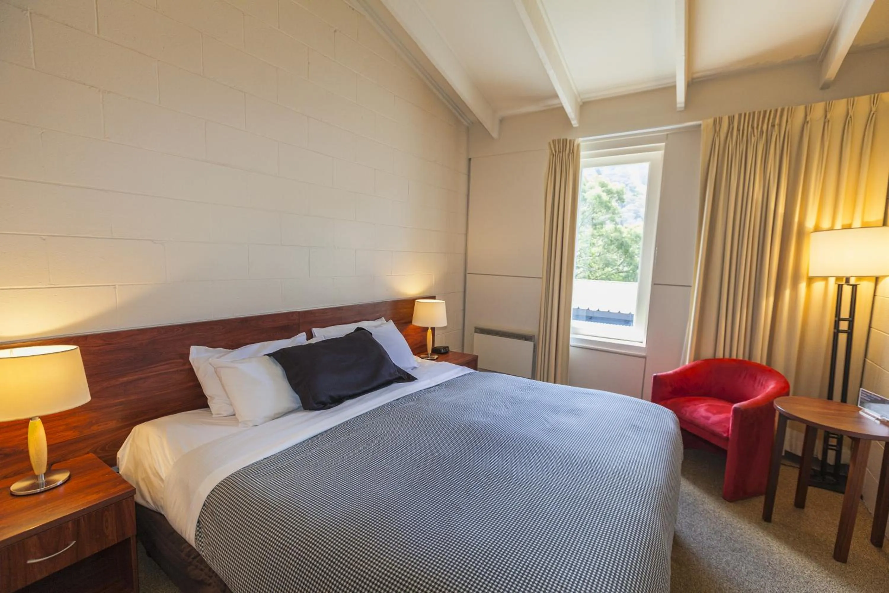 Bed in The Denman Hotel in Thredbo