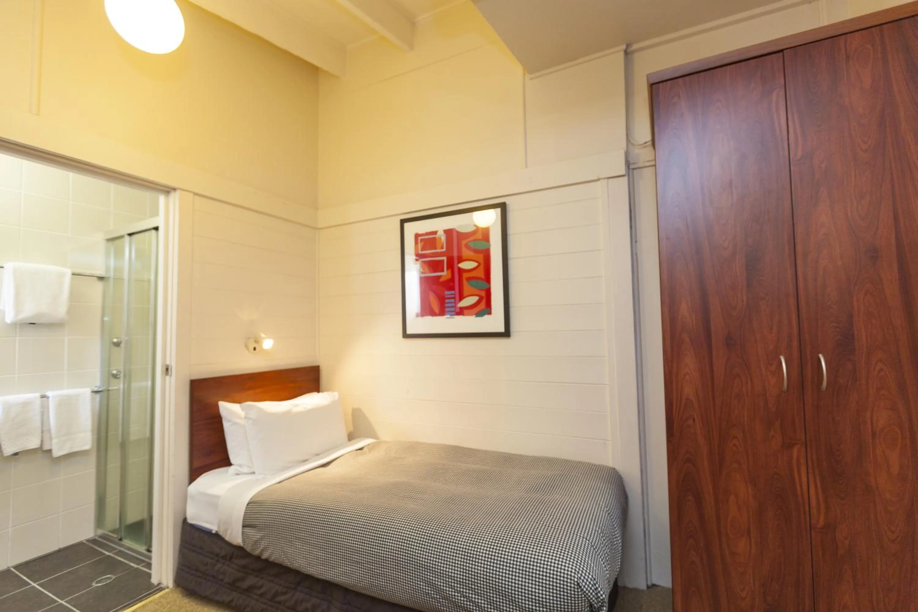 Bed in The Denman Hotel in Thredbo