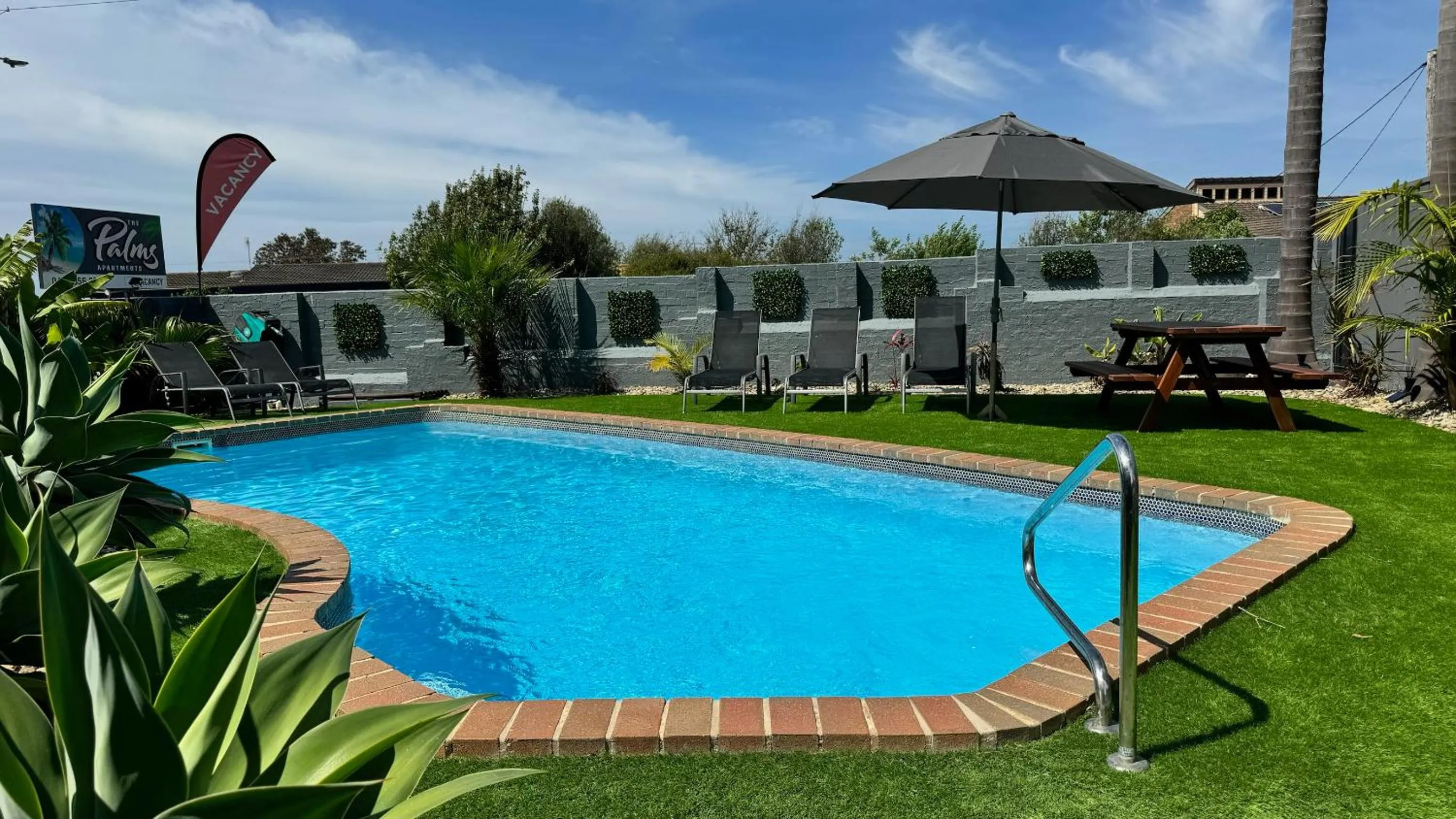 Swimming pool in The Palms Apartments