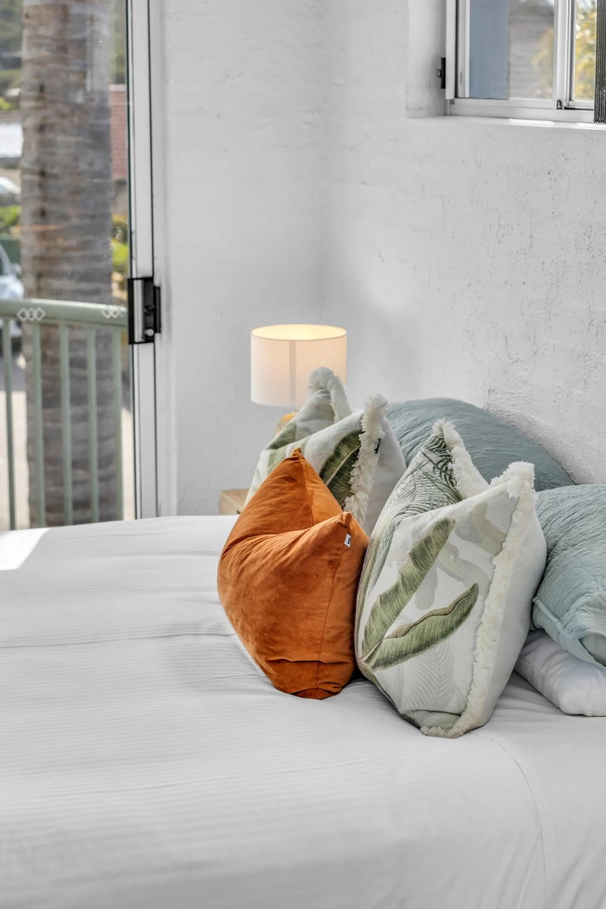 Bed in The Palms Apartments