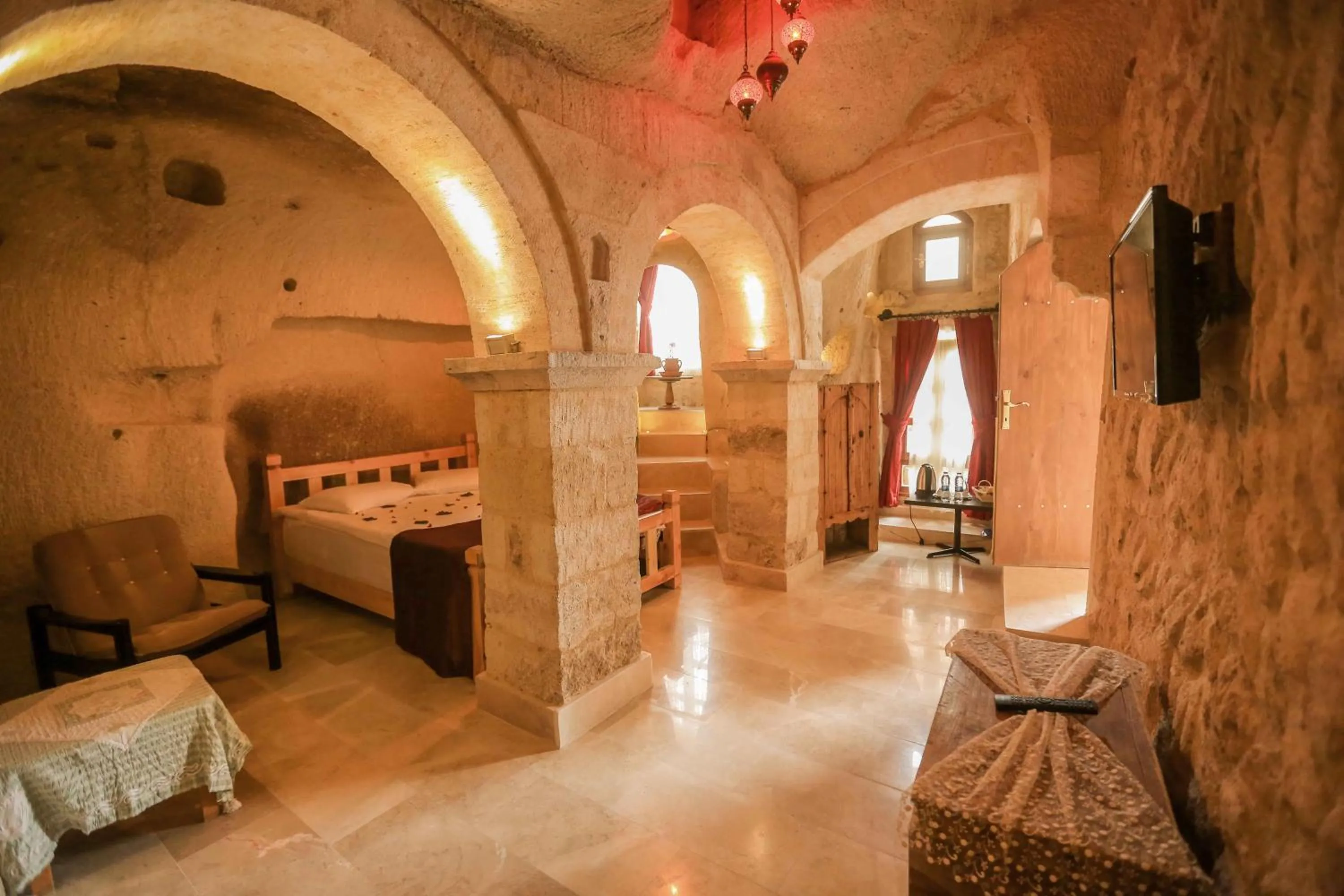 Living room, Bed in Abu Hayat Cave Suites