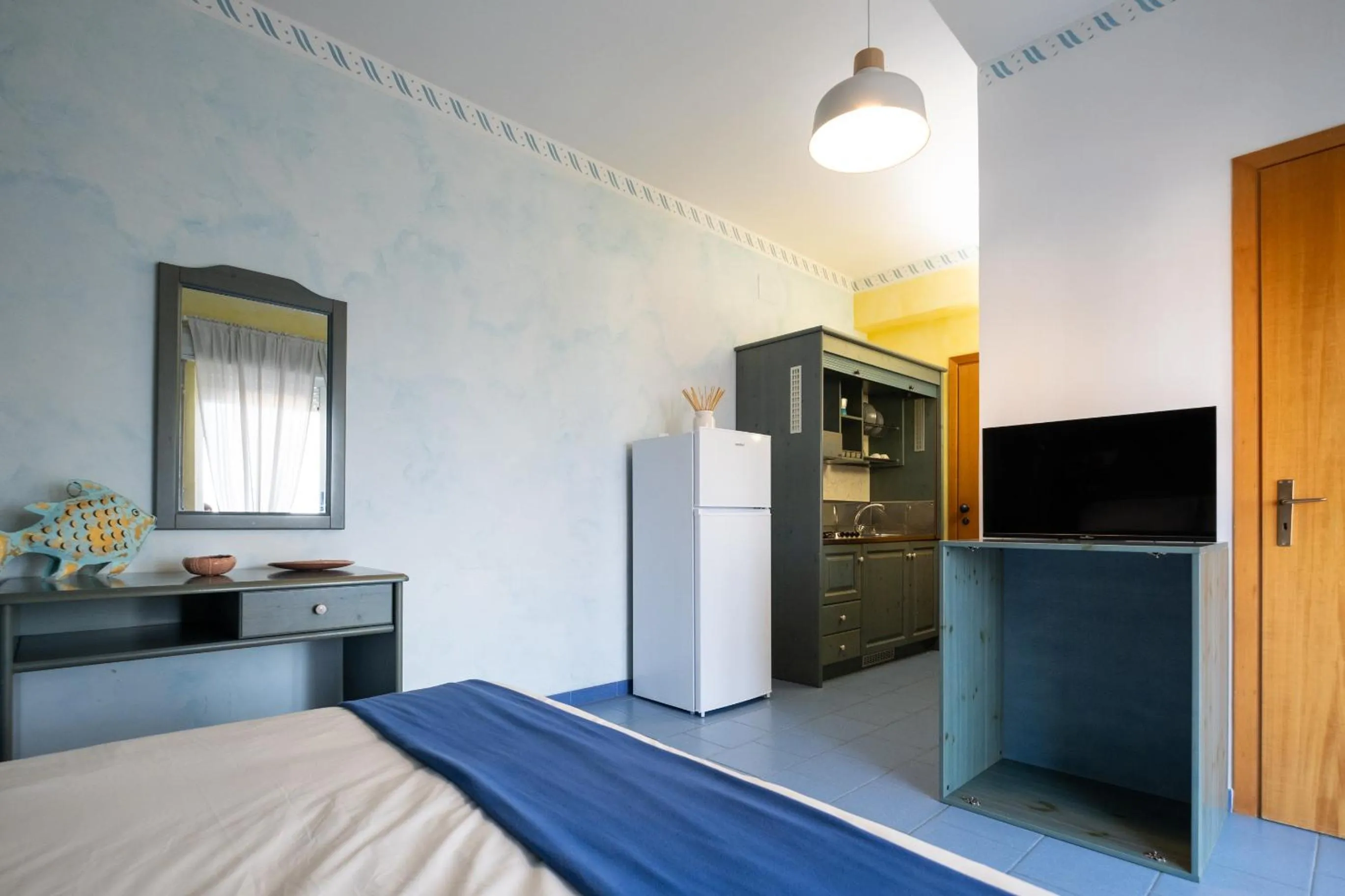 Kitchen or kitchenette, Bed in Oasi Azzurra