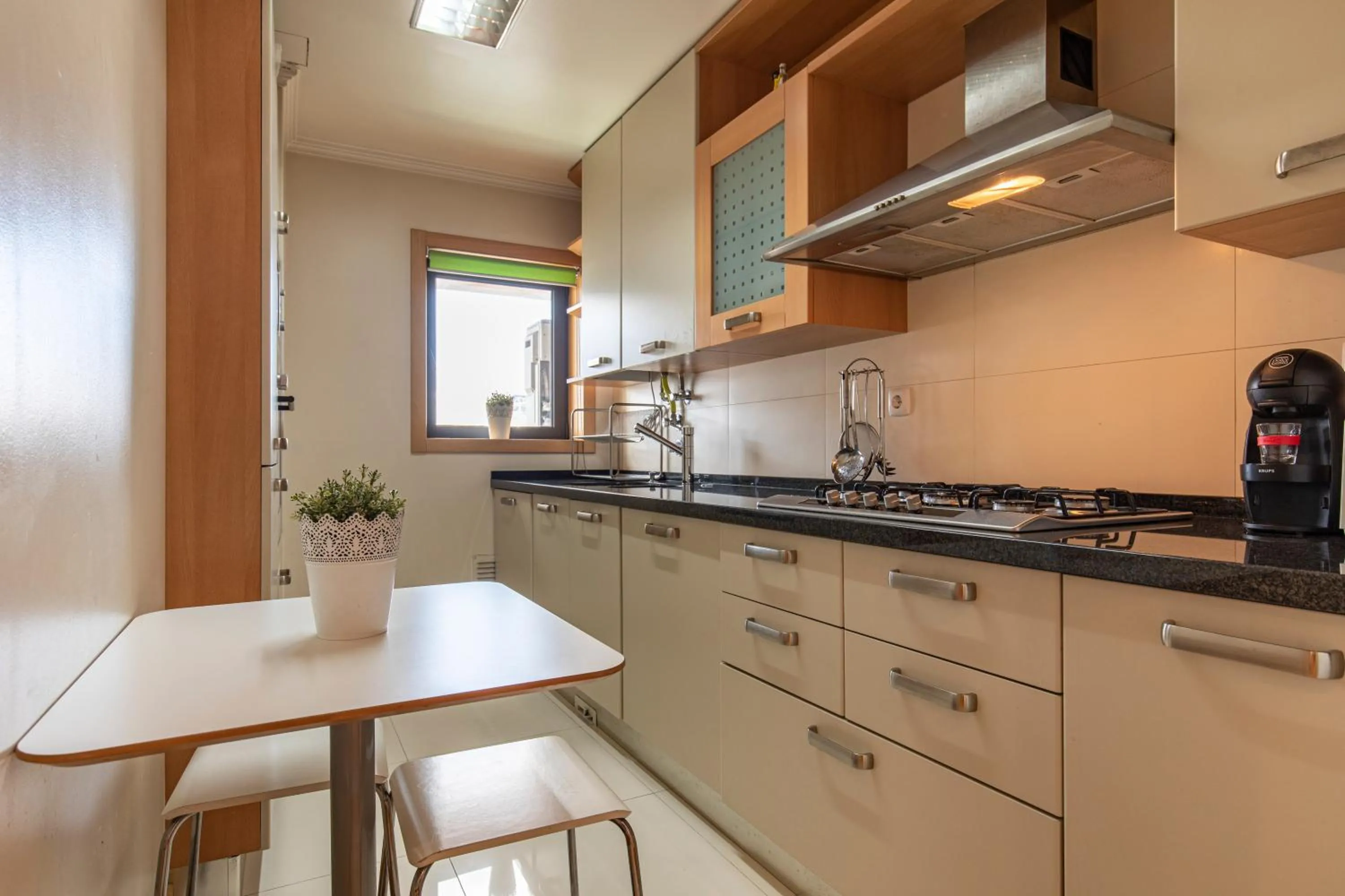 Kitchen or kitchenette in LovelyStay - Modern apartment in Anjos