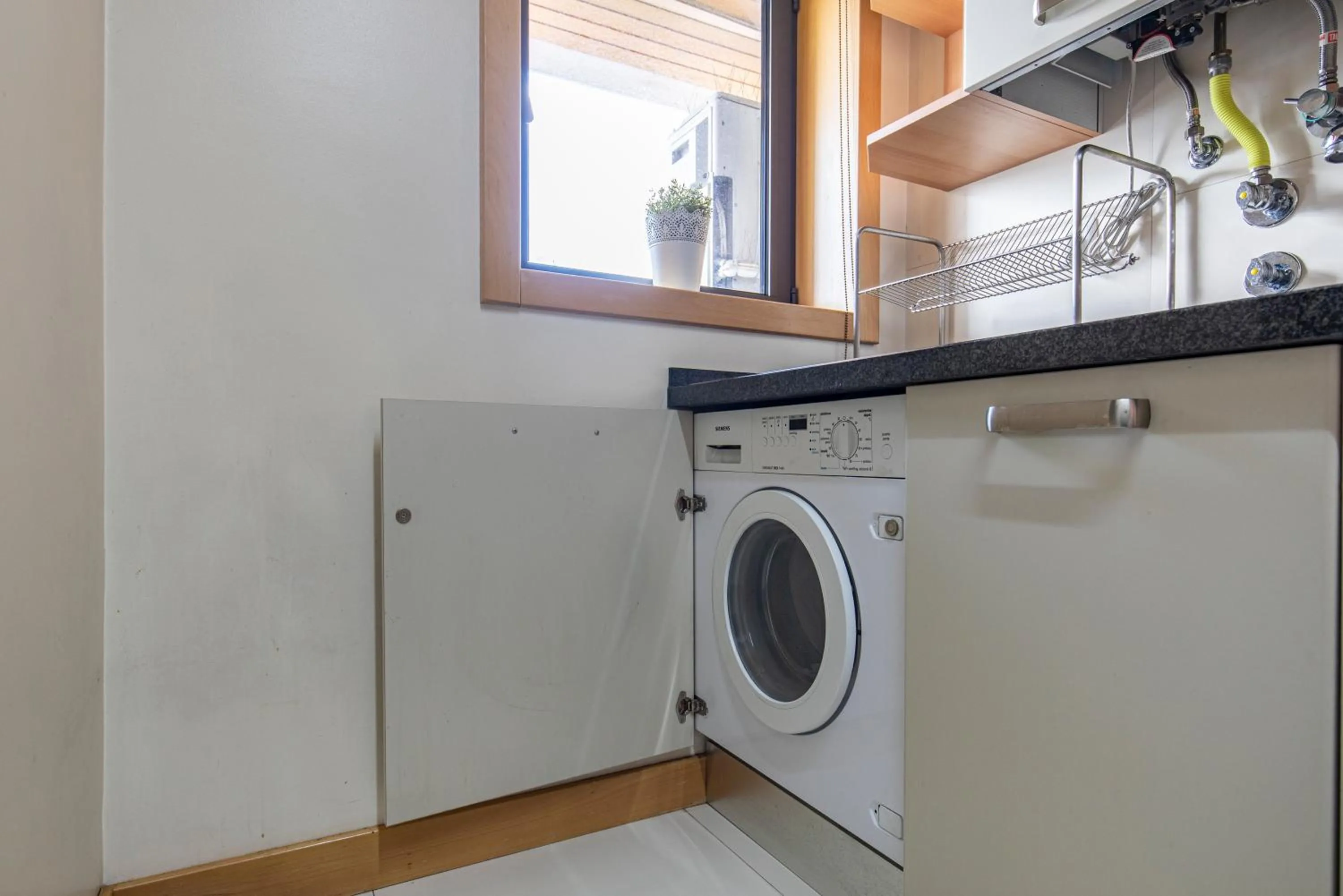 Kitchen or kitchenette in LovelyStay - Modern apartment in Anjos