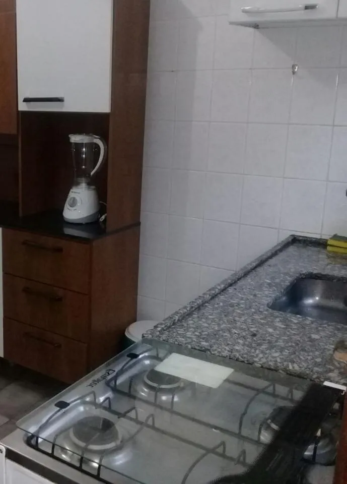 Kitchen or kitchenette in Conforto na praia