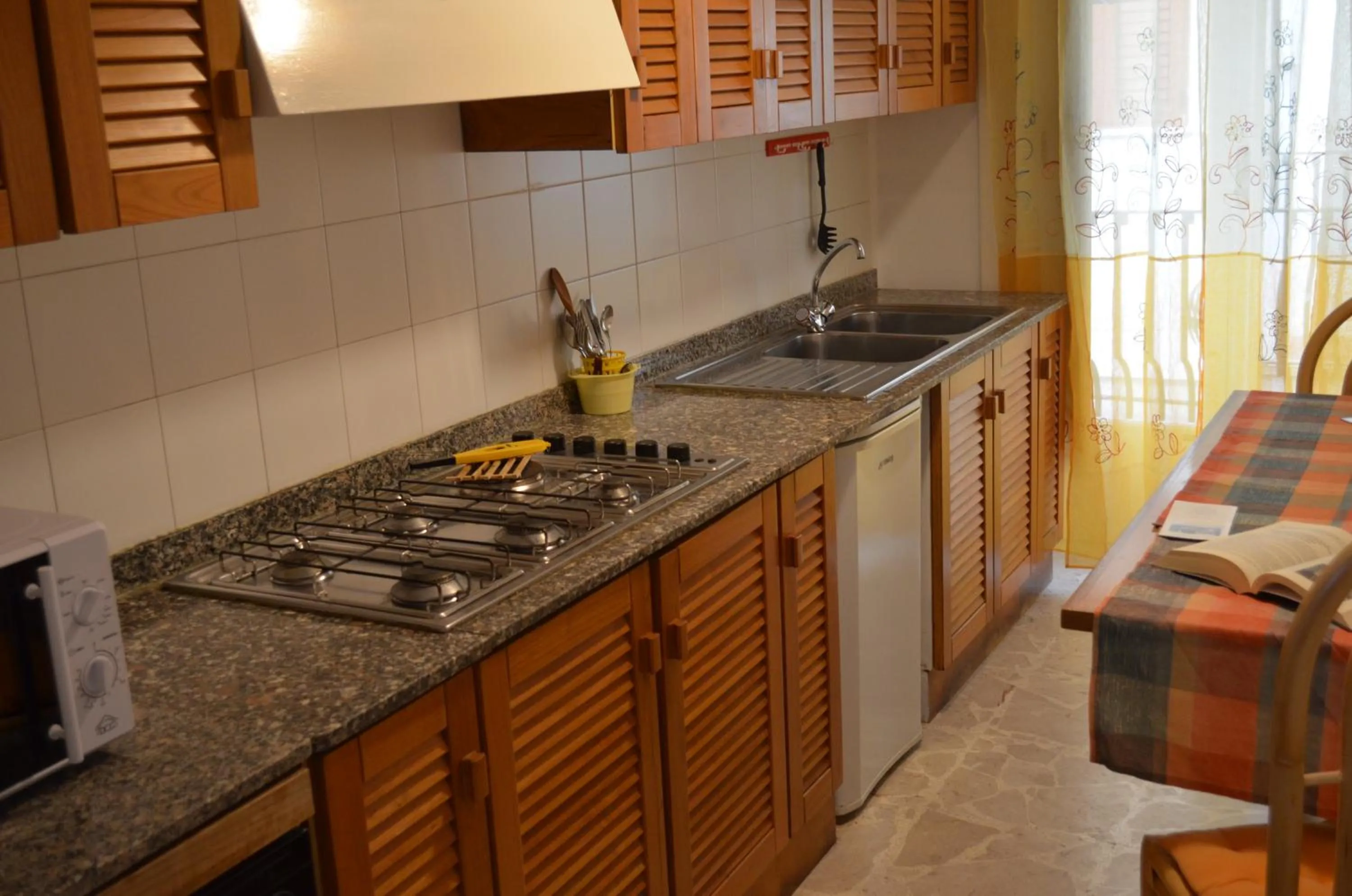 Kitchen or kitchenette in Case Vacanze Arcobaleno