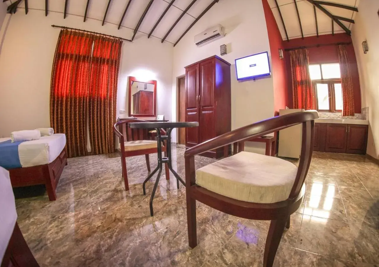 Toilet, Bed in White Rose Beach Resort Toilet, Bed in White Rose Beach Resort