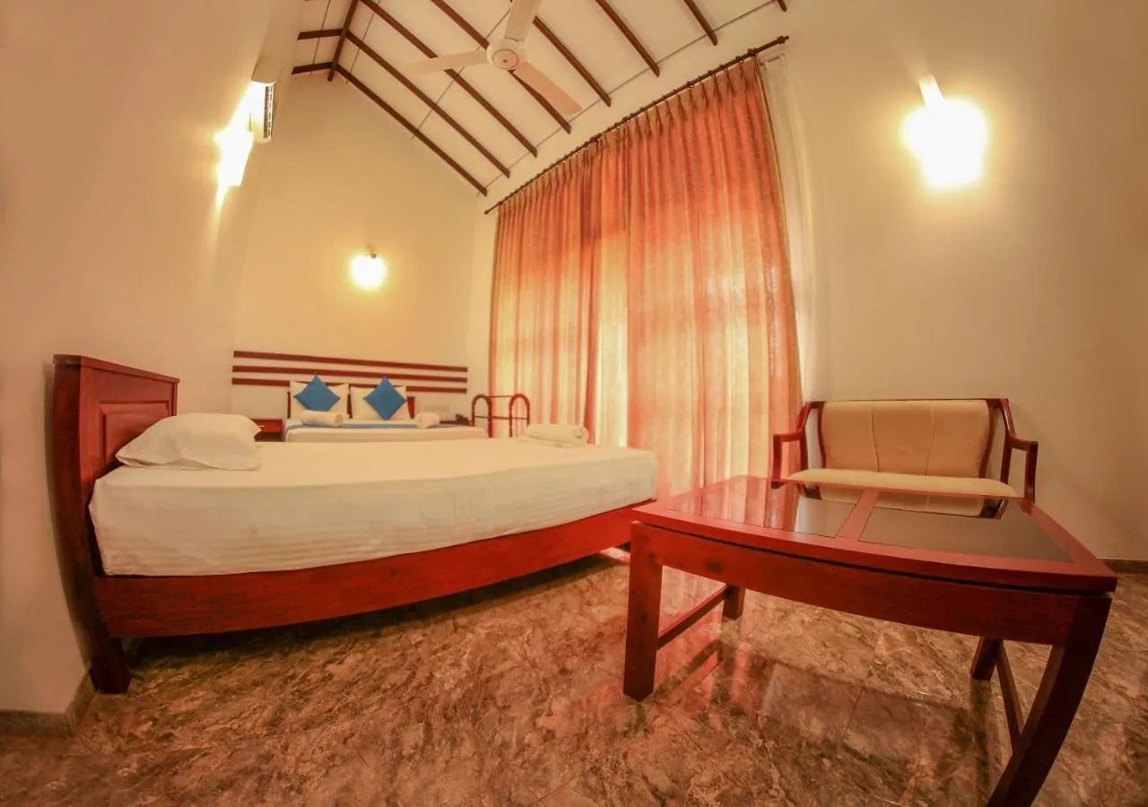 Bed in White Rose Beach Resort