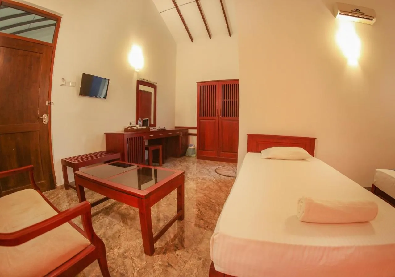 Toilet, Bed in White Rose Beach Resort