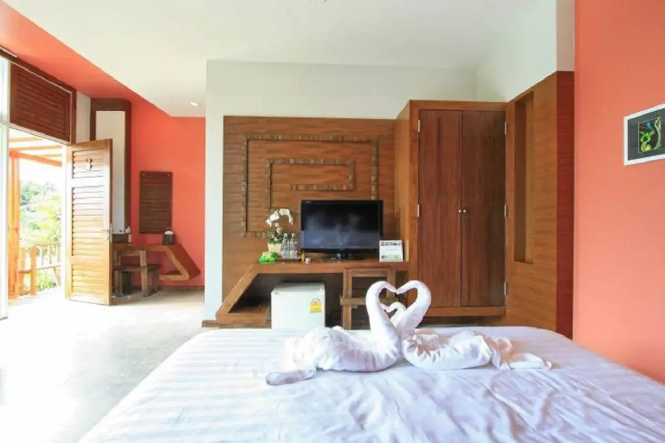 Photo of the whole room, TV/Entertainment Center in Nana Resort Kaeng Krachan - SHA Plus Certified