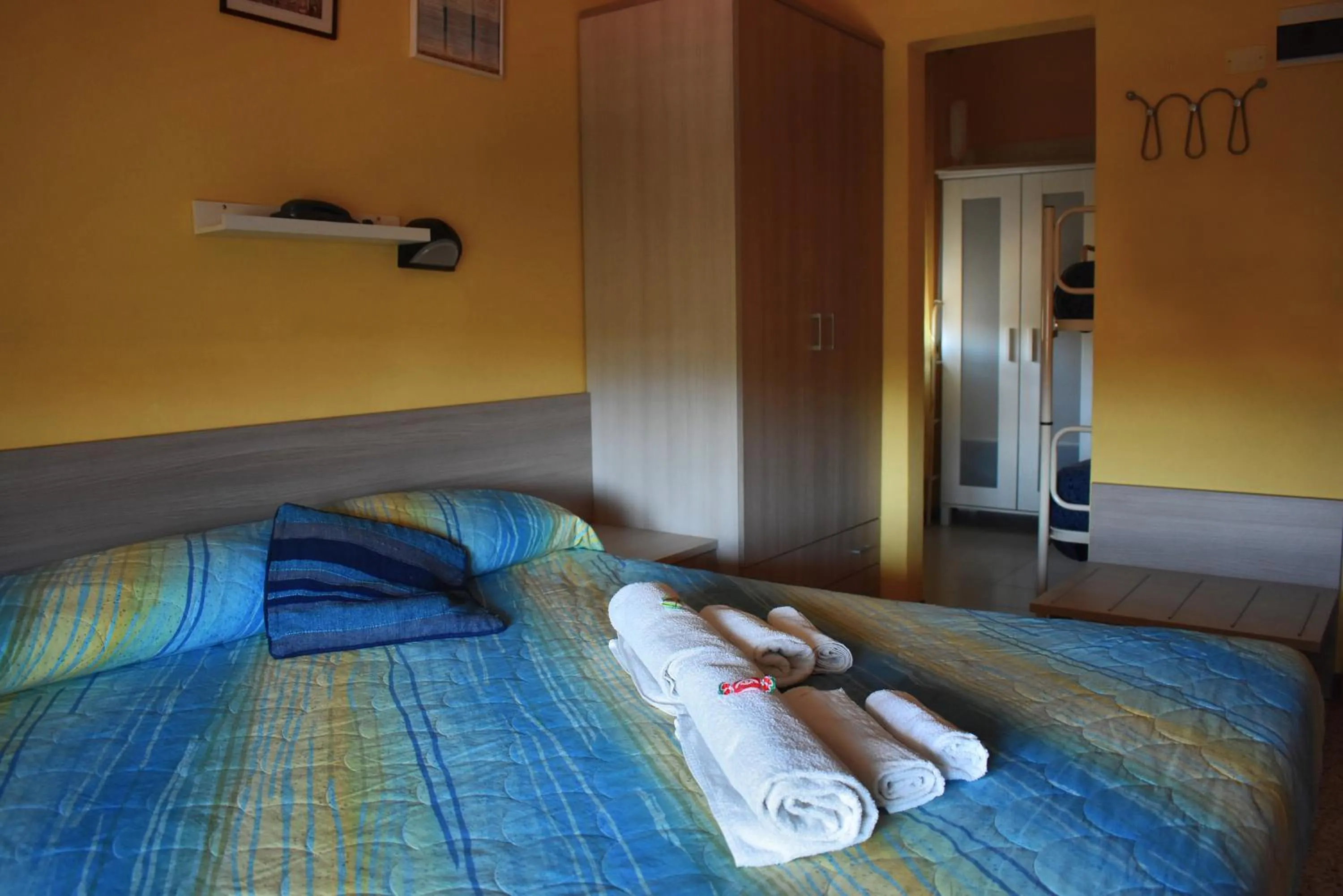 Bed in Hotel Urbinati